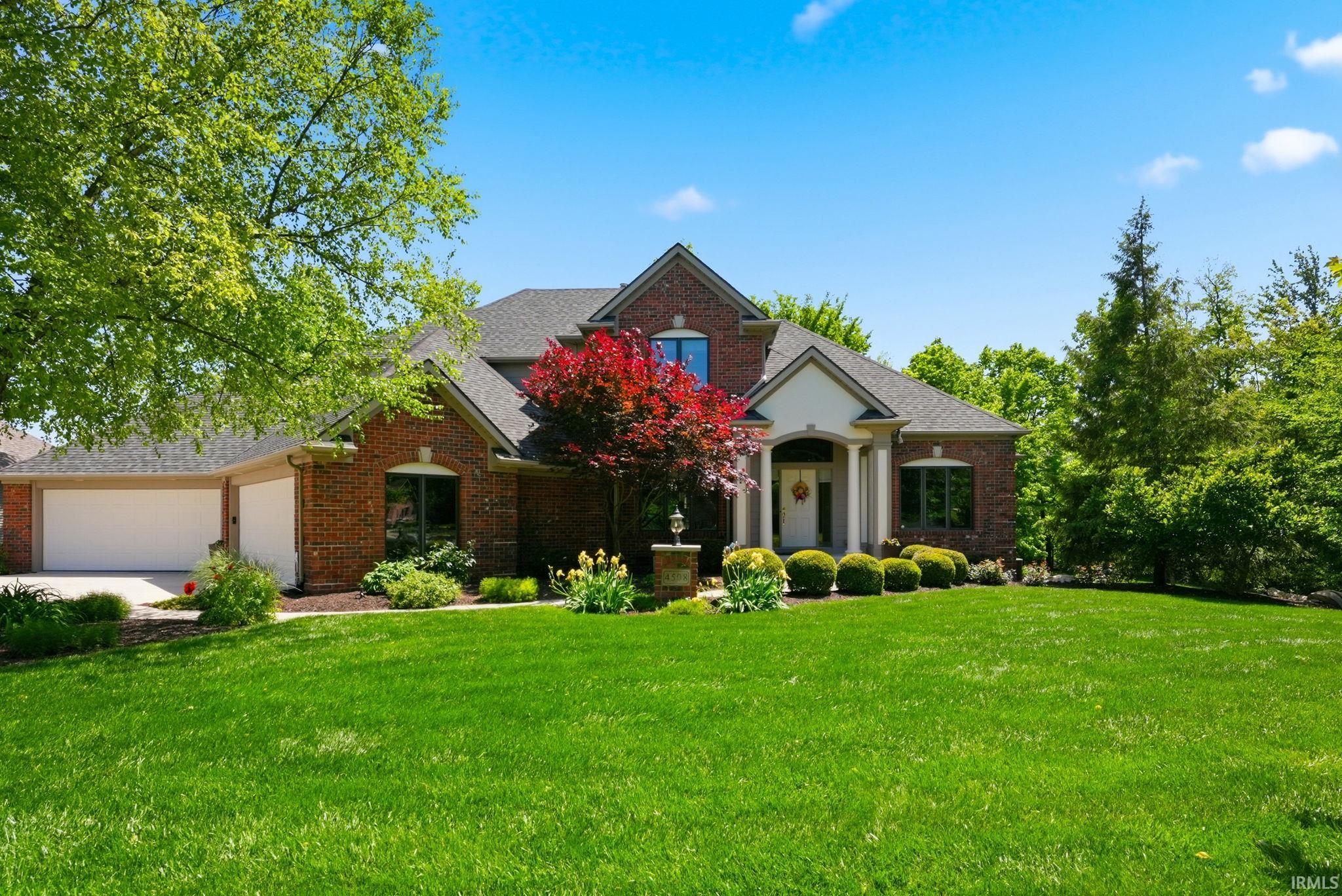 Brick exterior with a prominent two-car garage