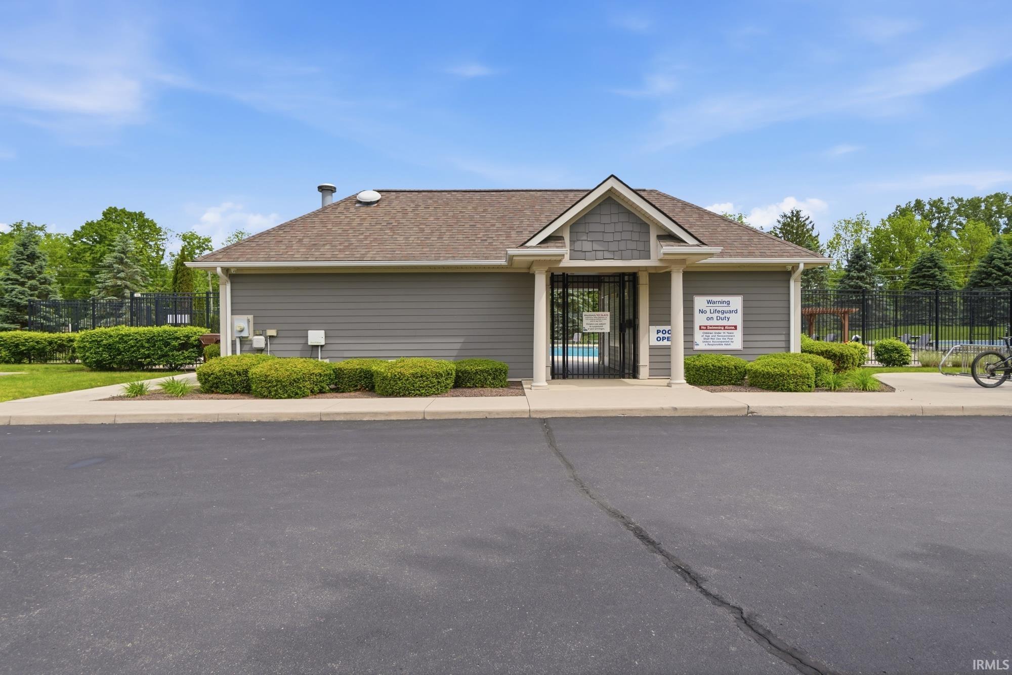Clubhouse building with gray siding and shingle accents