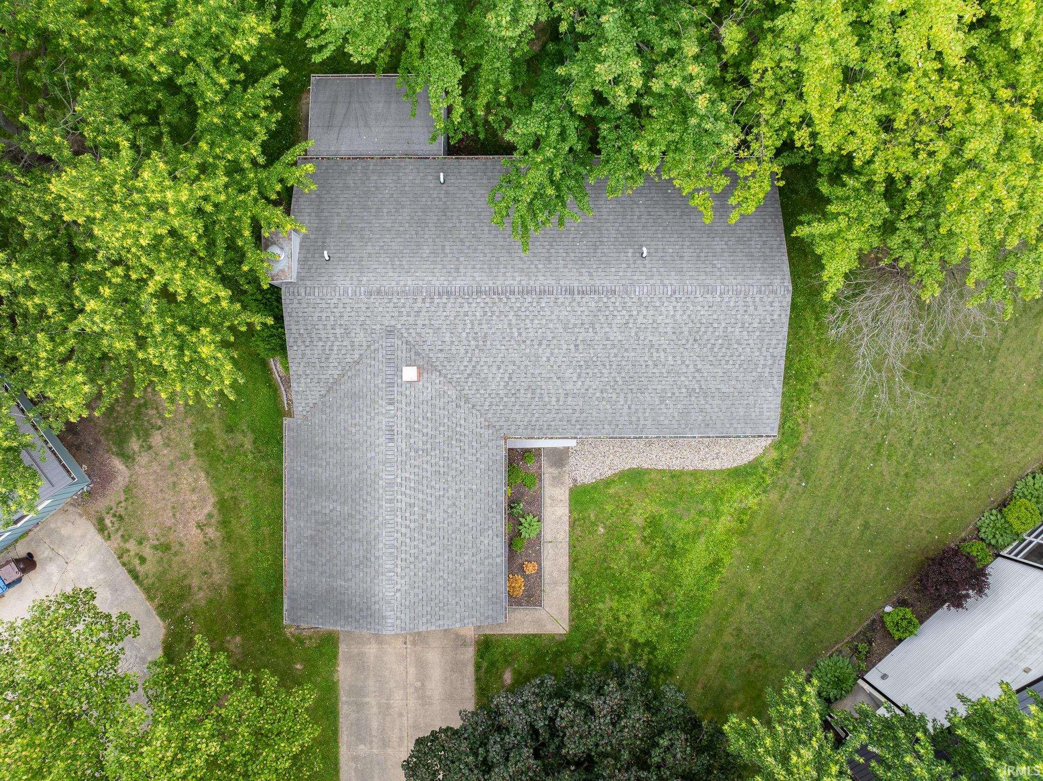 Gray shingle roof structure with multiple gables