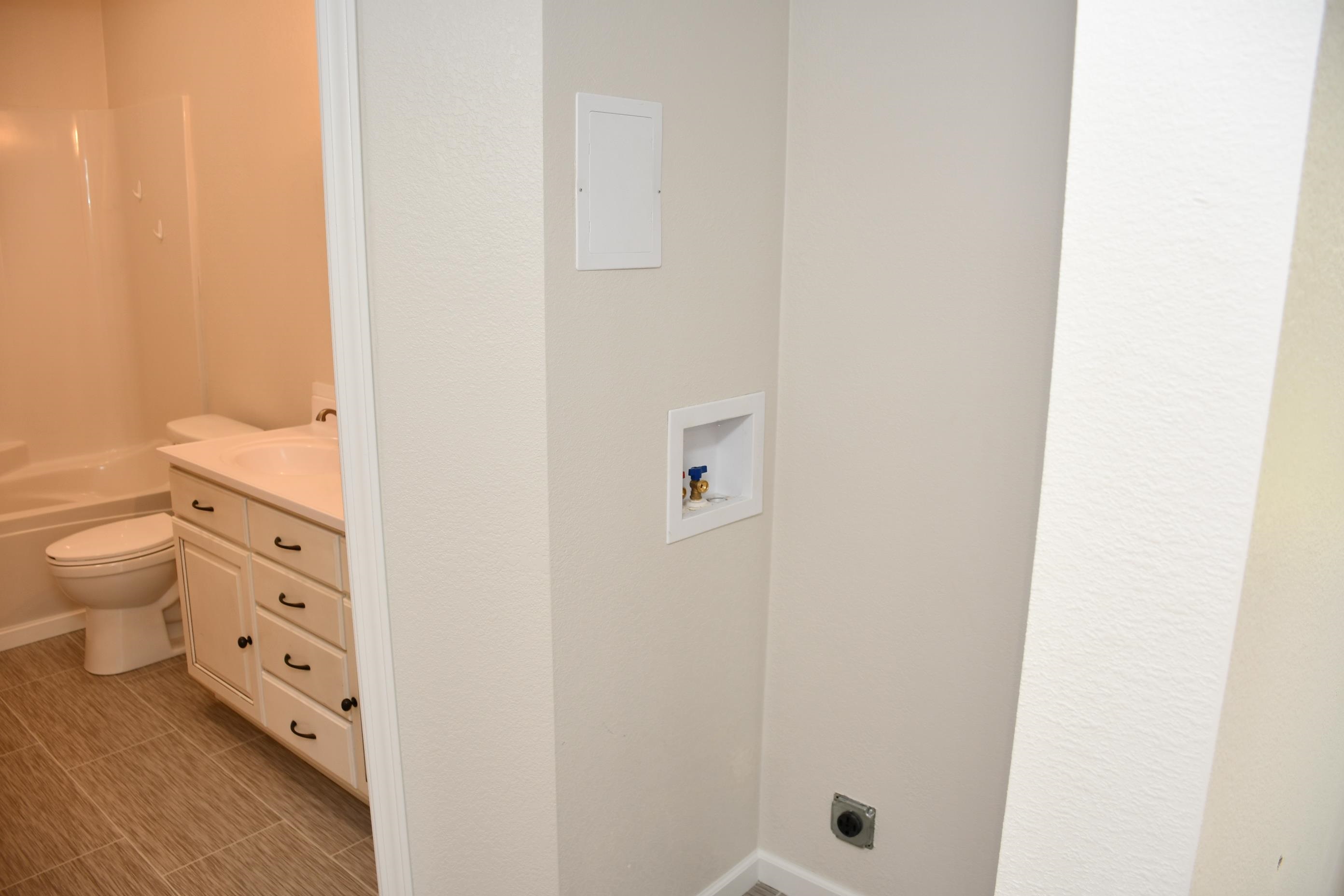 Dedicated laundry area with hookups