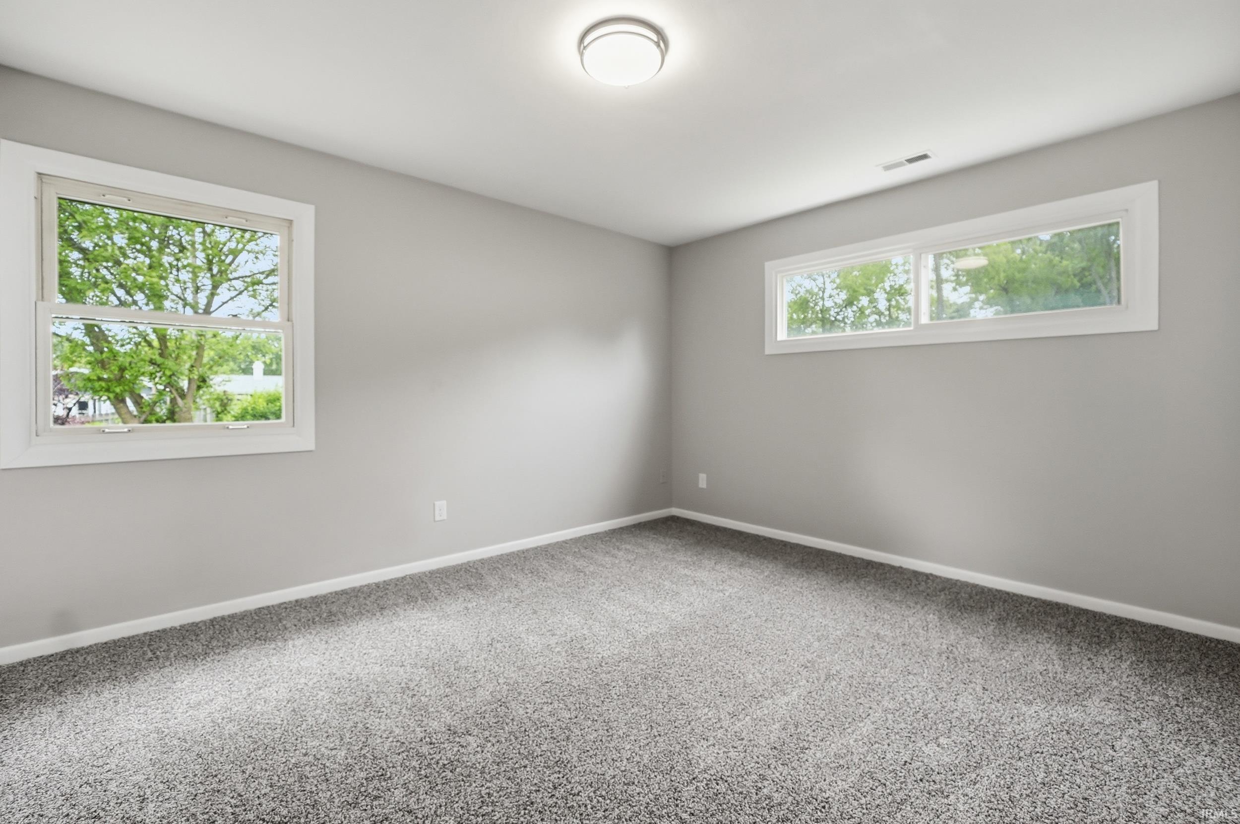 Neutral gray walls complement the new gray carpeting