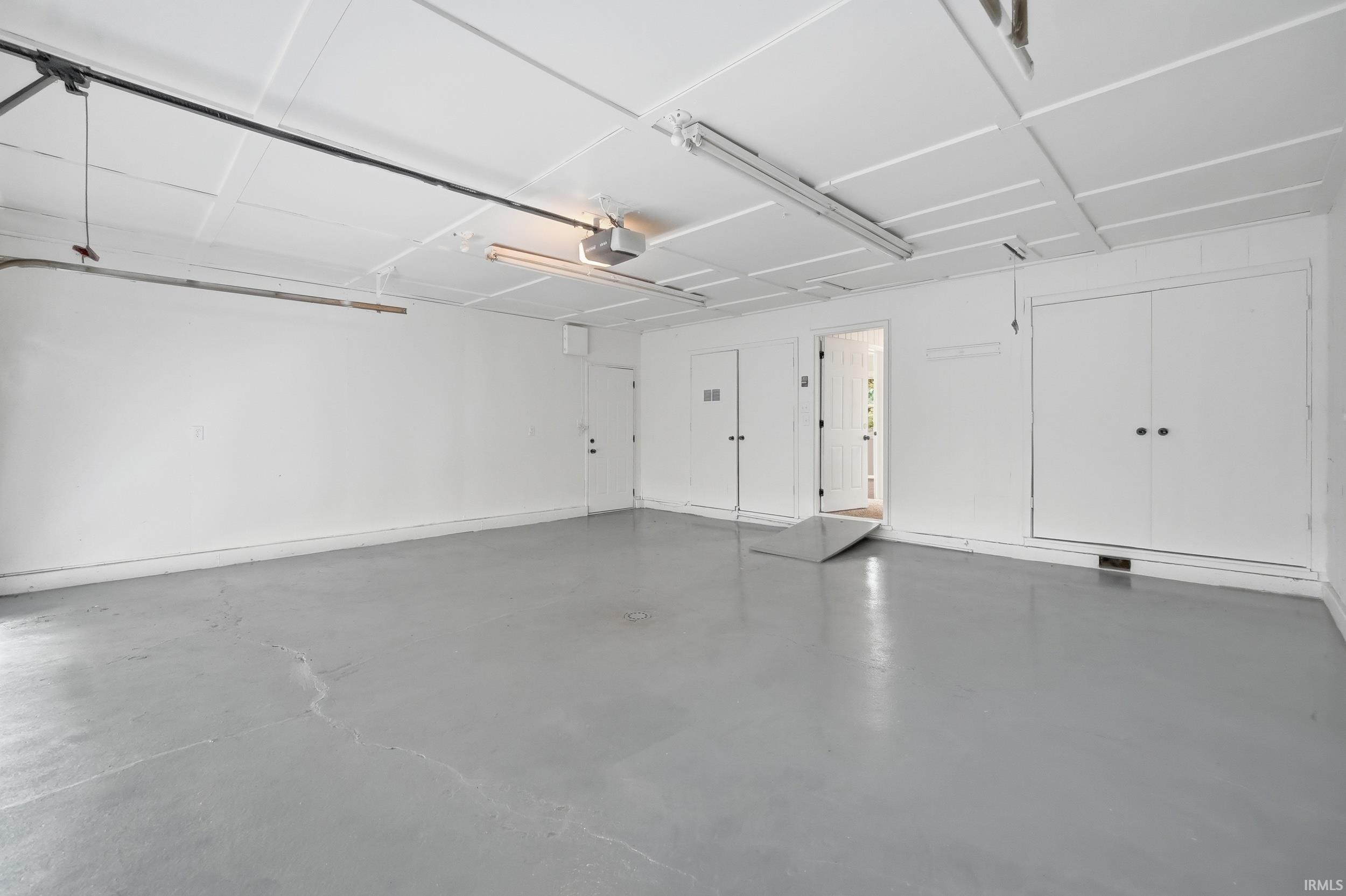 Spacious two-car garage with a light gray painted floor