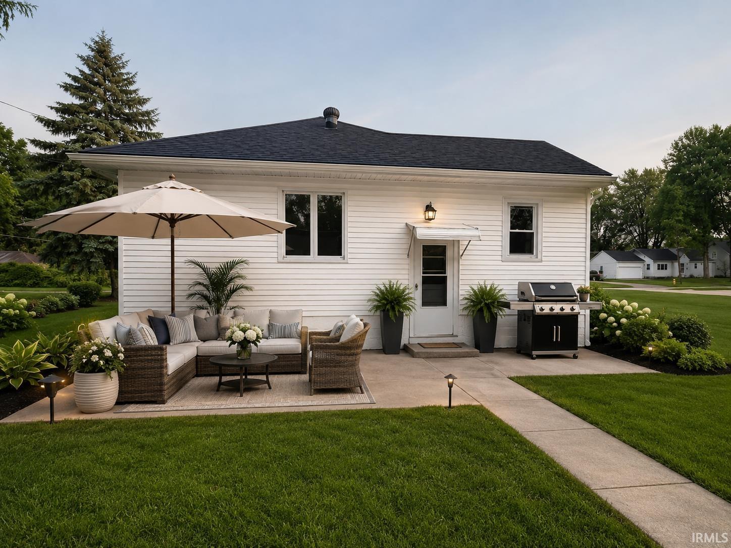 Expansive concrete patio with integrated lighting, Displaying original and virtually staged interior images of the property