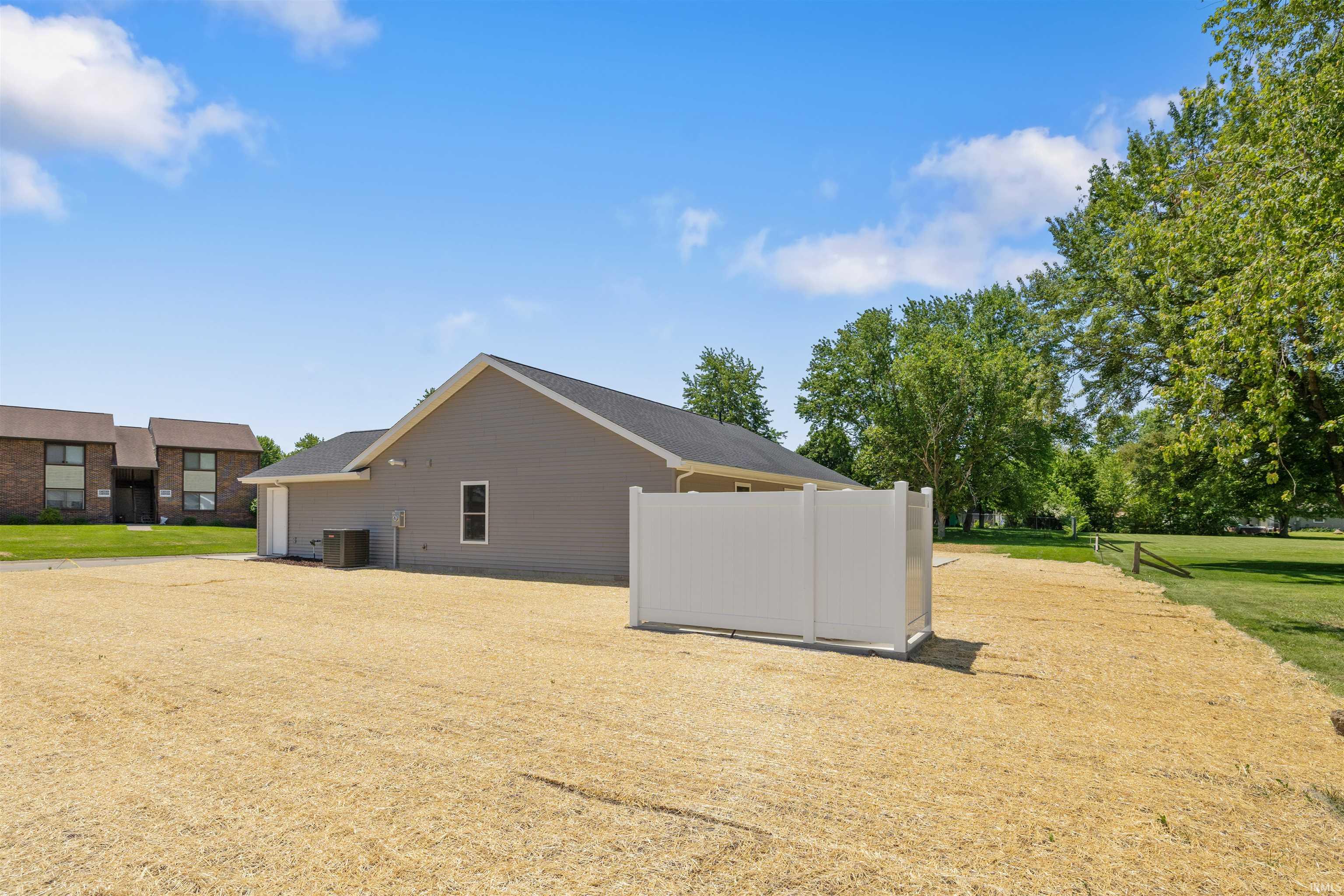 Modern exterior with gray siding and white trim