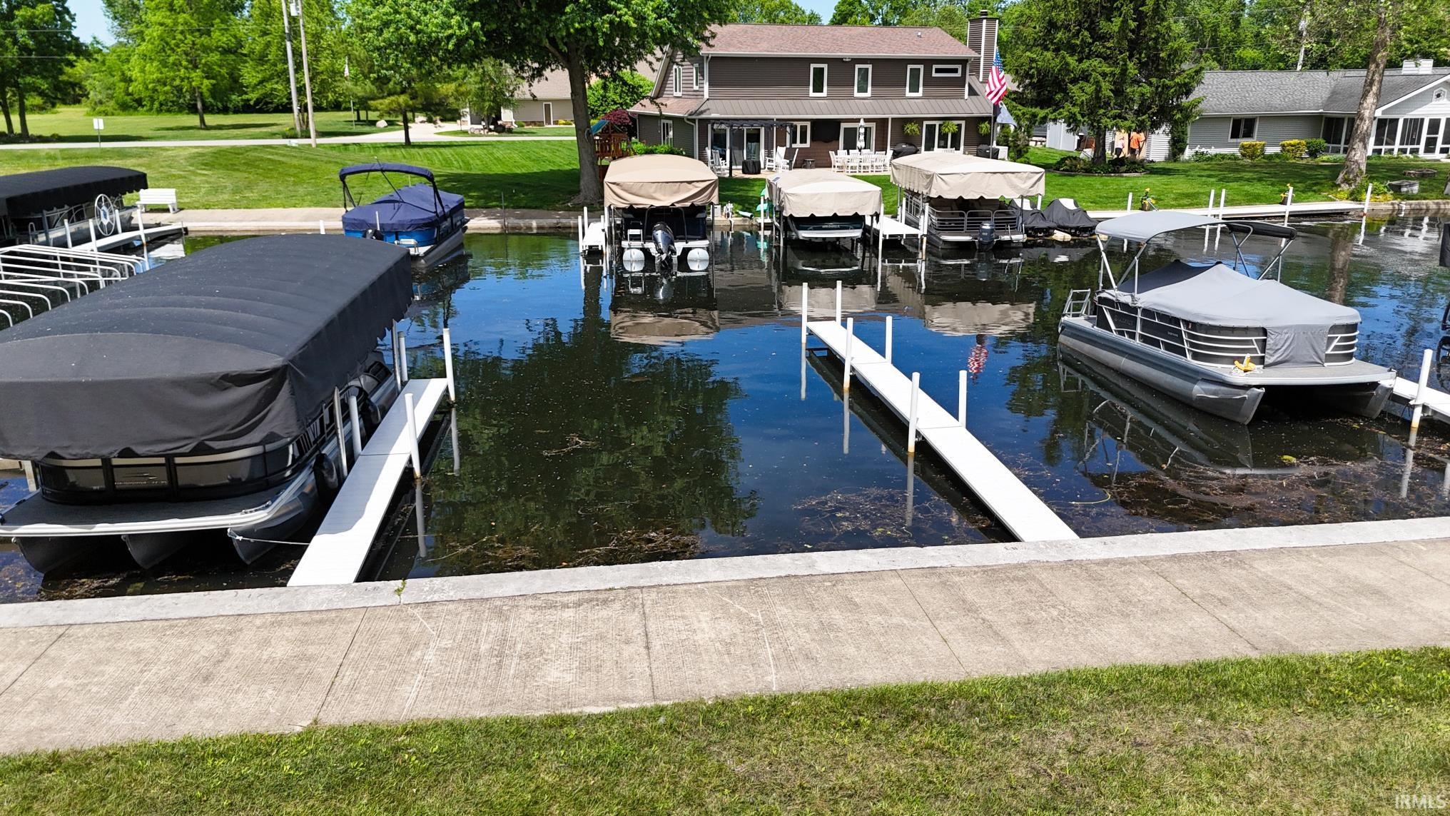 Concrete waterfront with multiple docks extending into the water