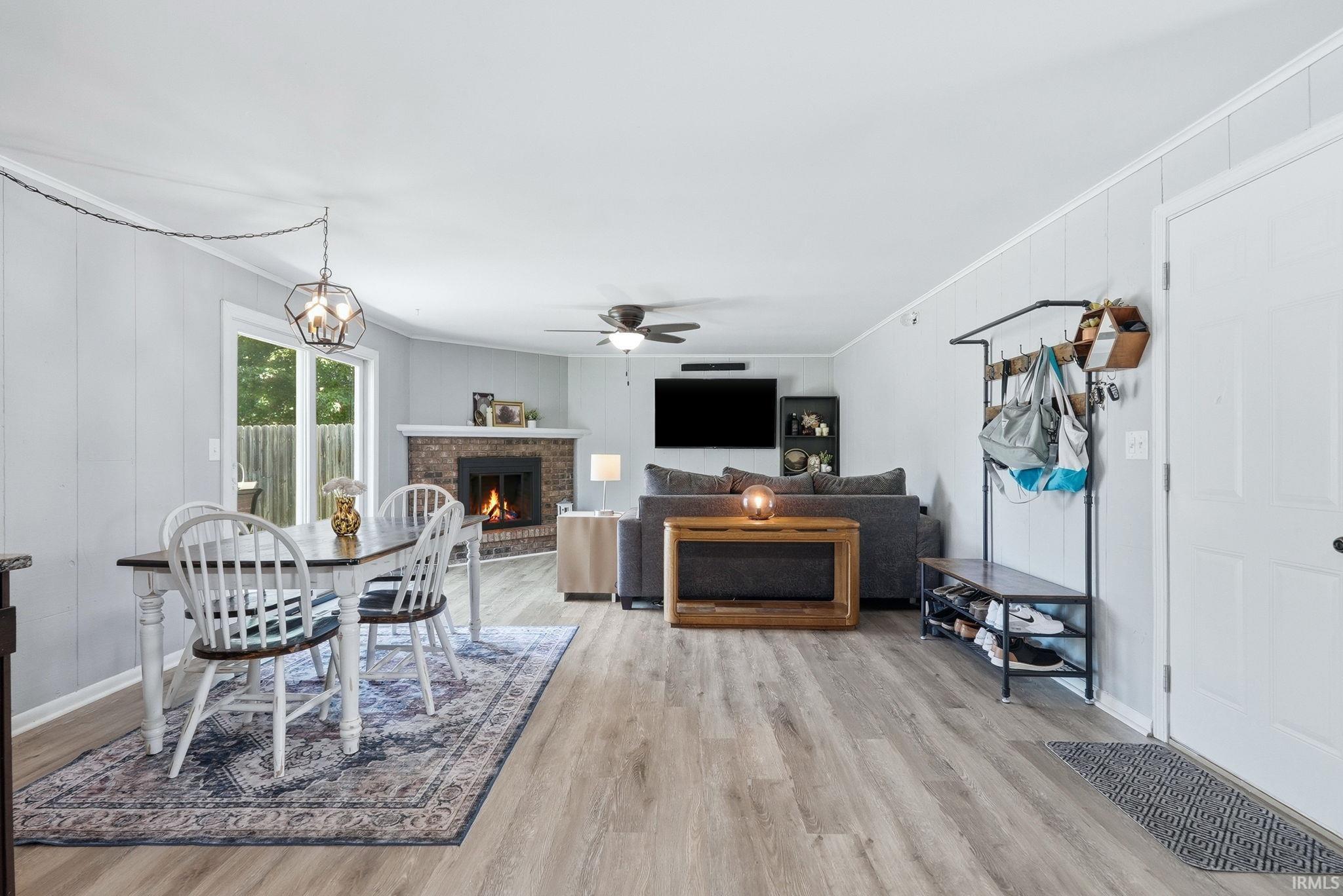 Open-concept living space featuring wood-finish flooring throughout