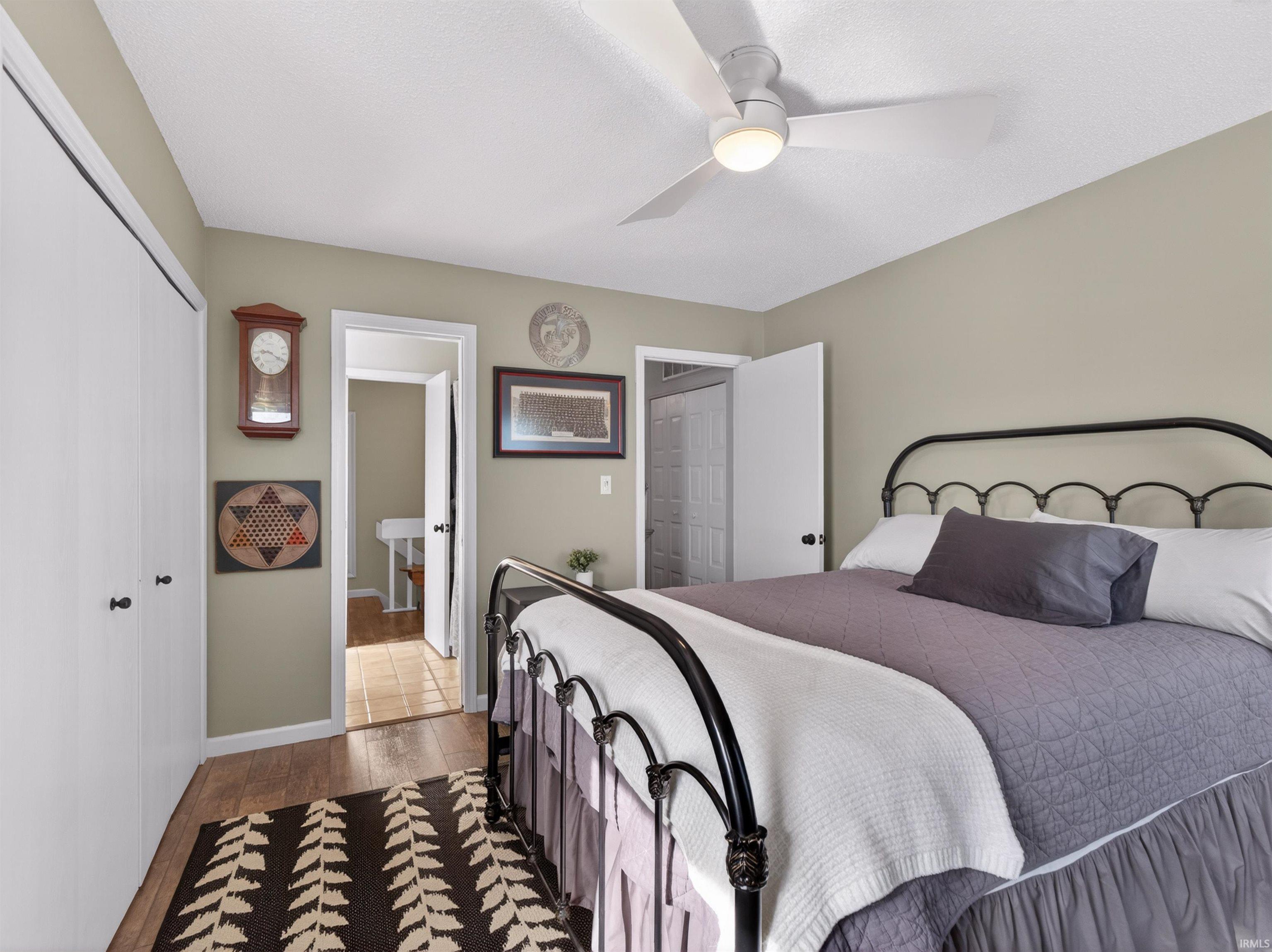 Bedroom featuring wood-finish flooring and neutral wall tones