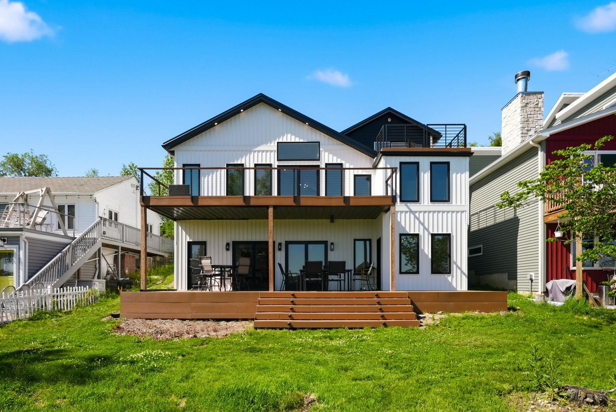Modern white vertical siding exterior with contrasting black trim