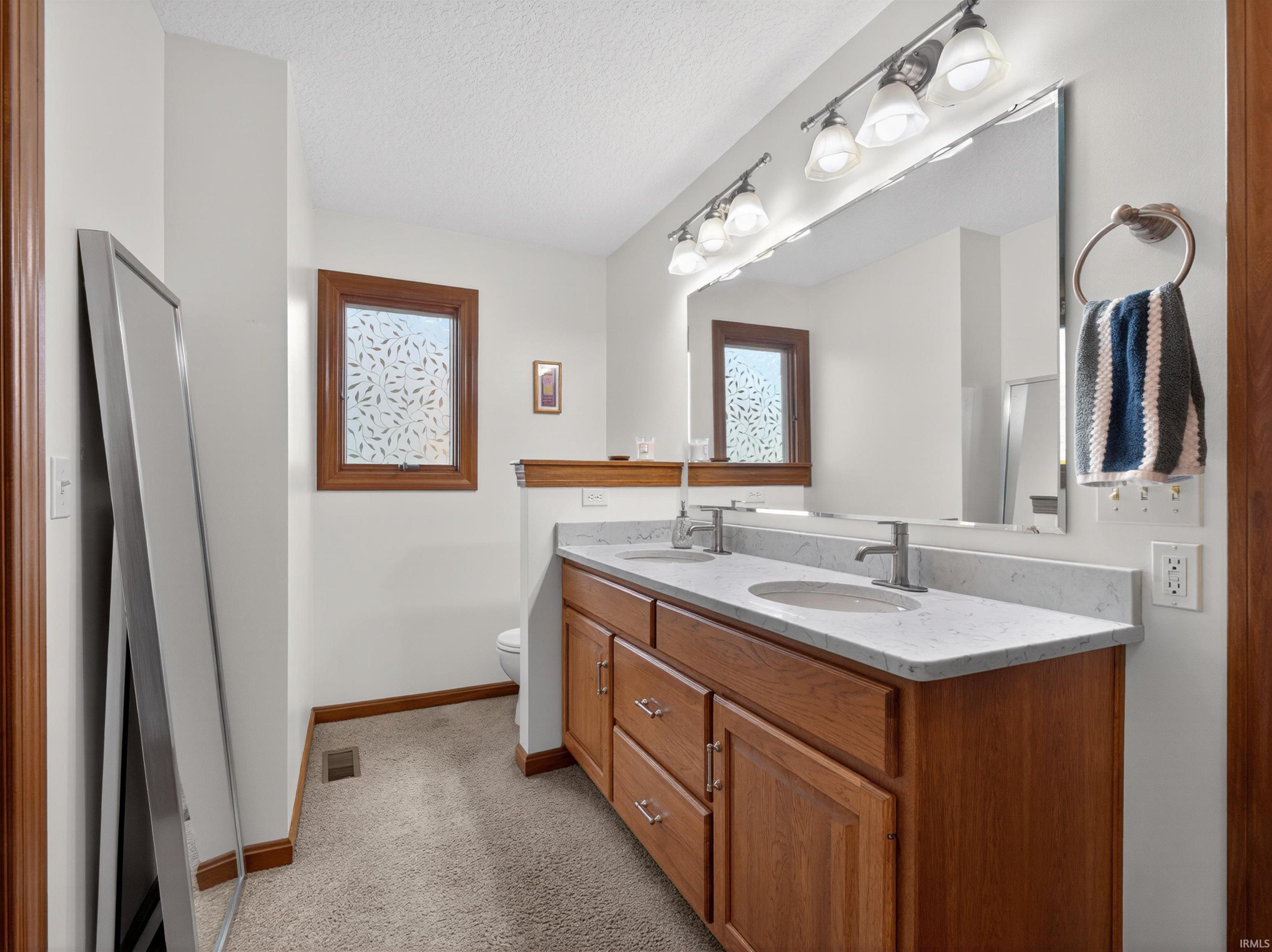 CUSTOM GRABILL cabinetry, and brushed nickel faucets, PRIVATE TOILET, WINDOW FOR NATURAL LIGHT, STANDUP SHOWER WITH SEATS AND FOORS.