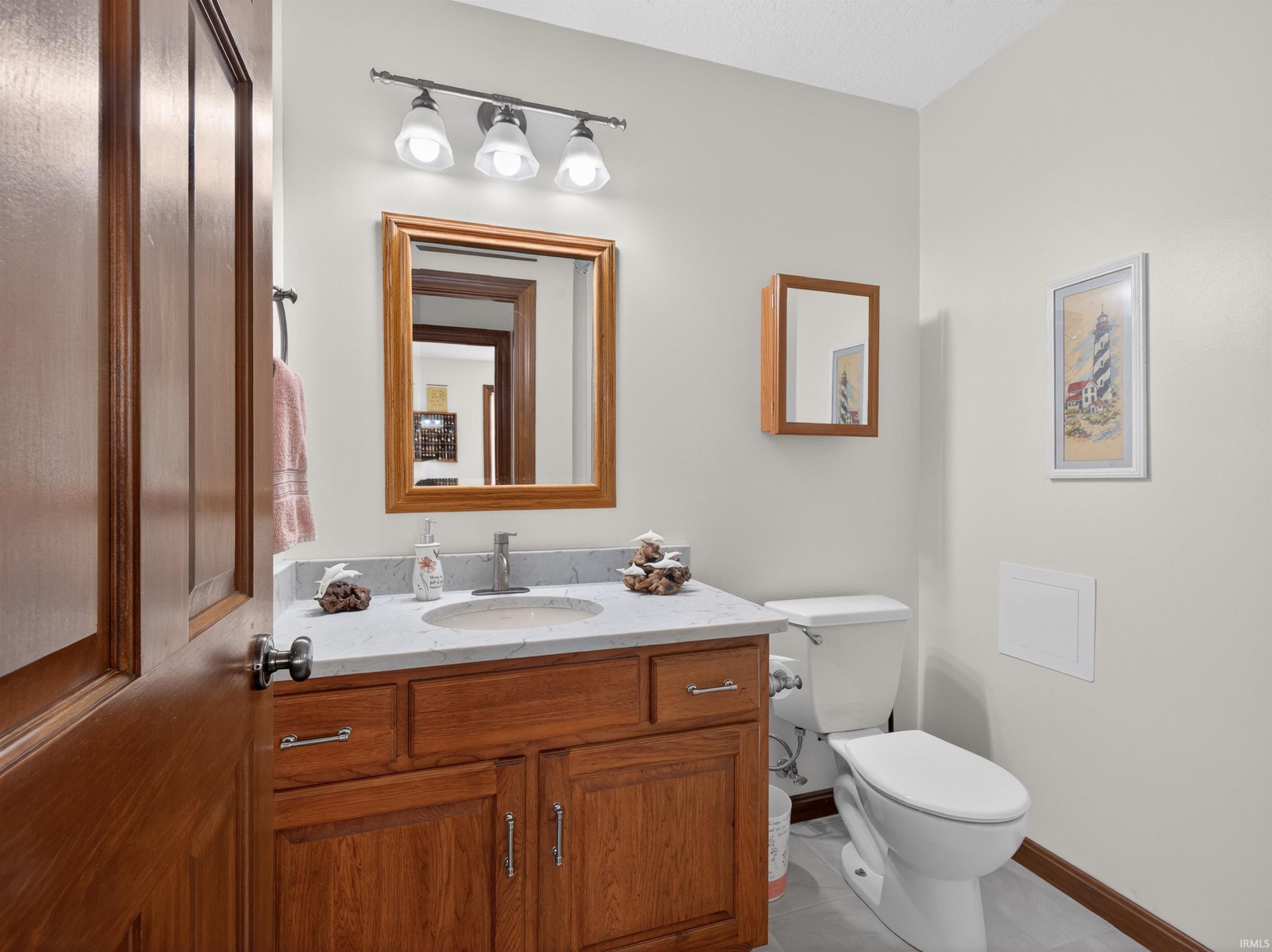 QUARTZ COUNTERTOP UNDER MOUNT SINK, and brushed nickel hardware, TUB SHOWER UNIT AND NATURAL LIGHT FROM WINDOW. ELONG TOILETS IN BOTH BATHROOMS