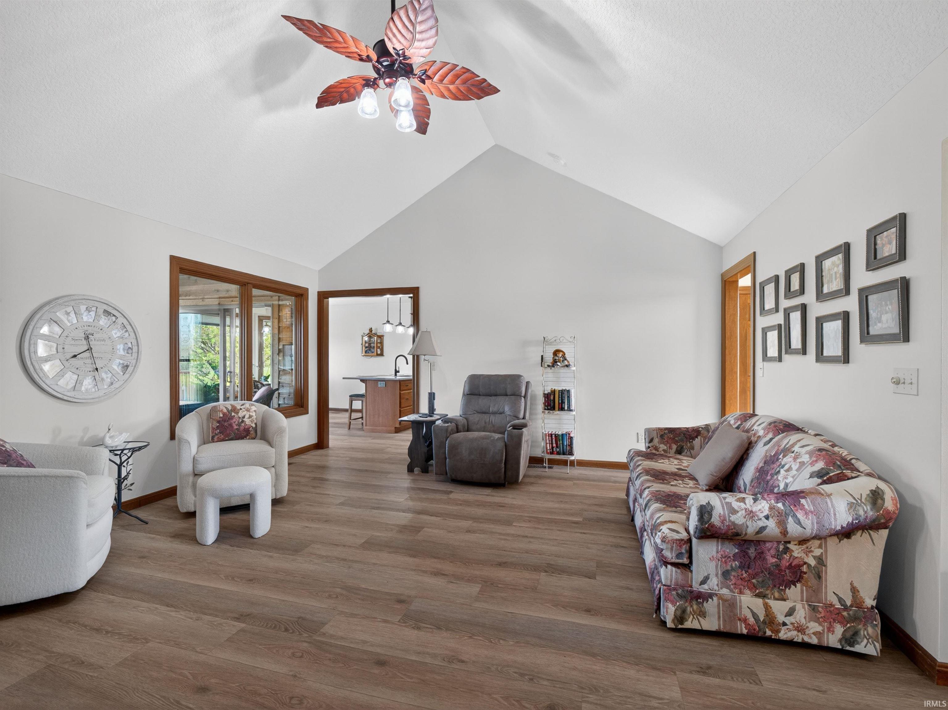 Vaulted ceiling with a decorative ceiling fan AND LIGHT. LACED CEILING