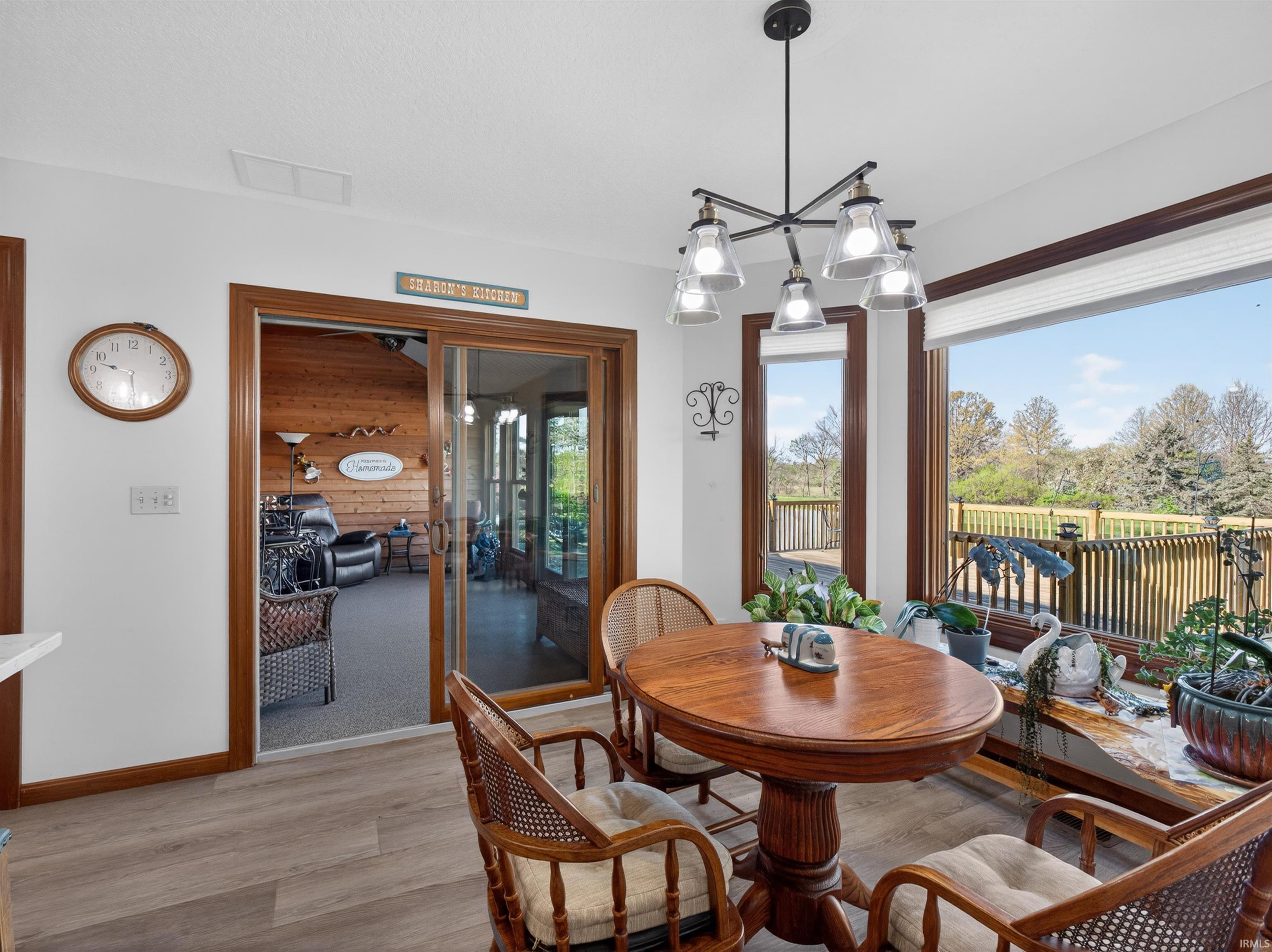 Dining area featuring a contemporary chandelier, and expansive windows