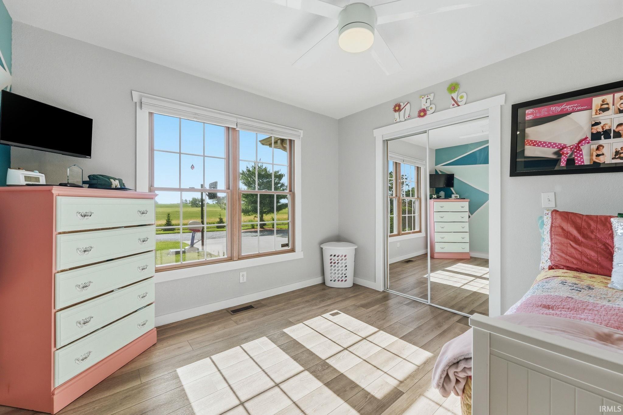 Wood-finish flooring complemented by a ceiling fan