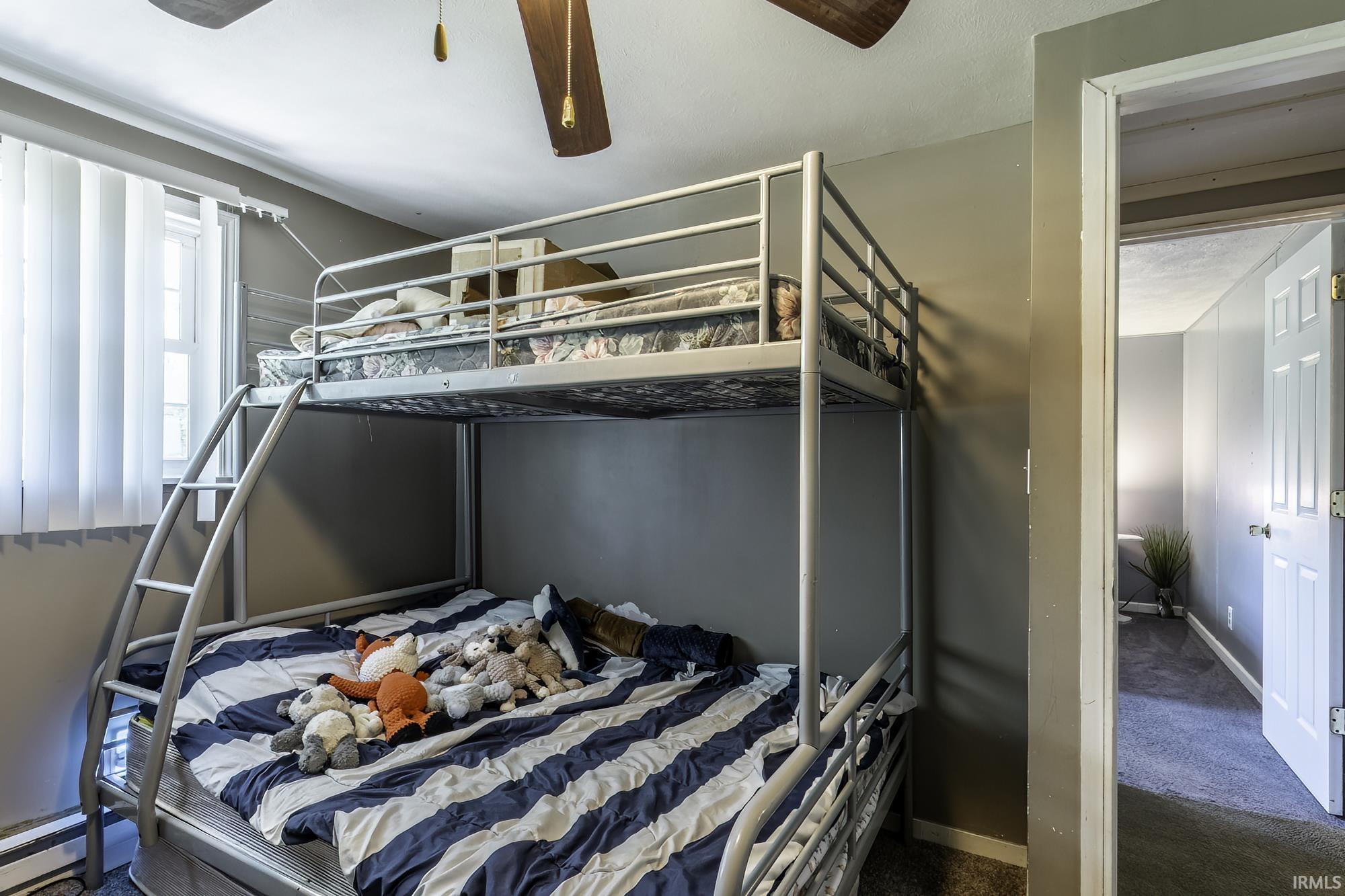 Bedroom featuring neutral wall colors and carpeted flooring