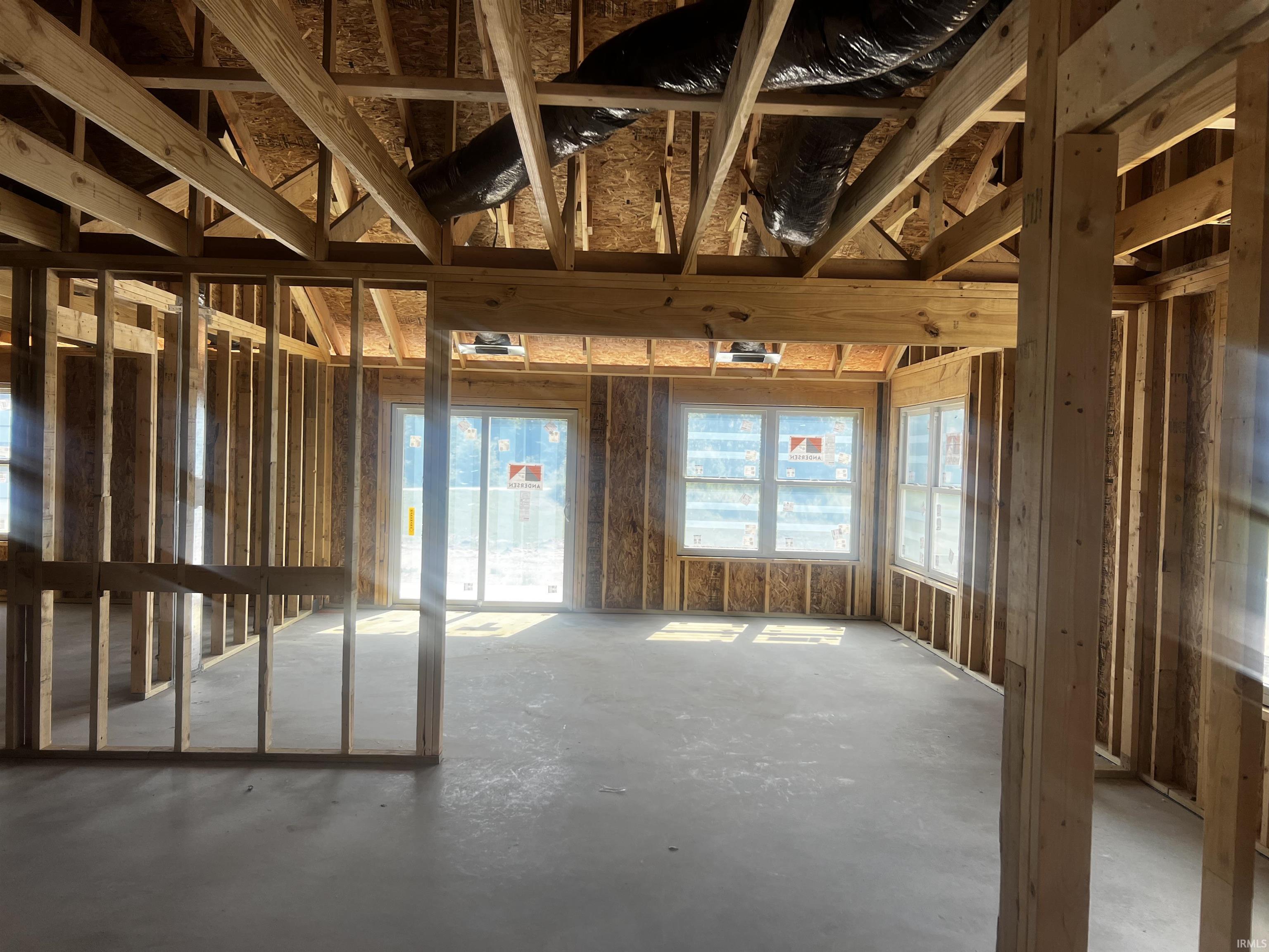 Framed interior space featuring exposed ceiling joists and subfloor