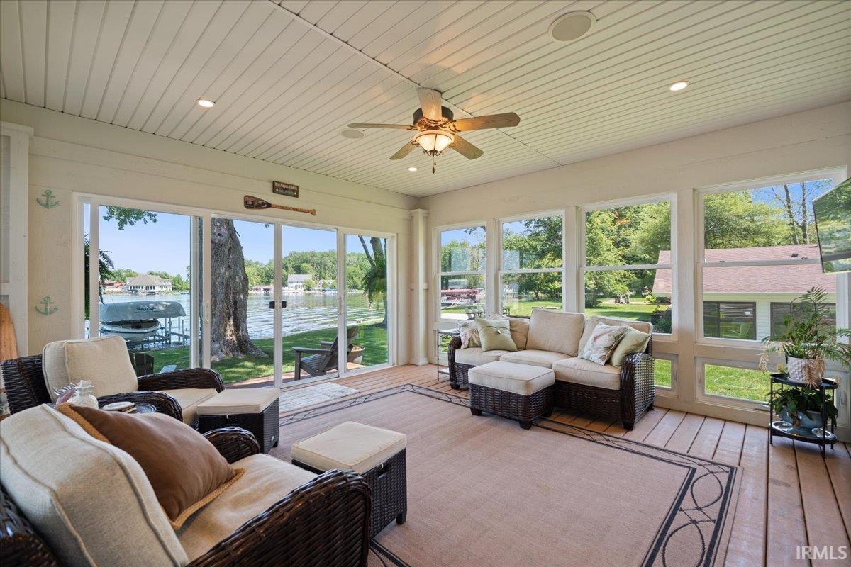 3 Season Room with independent heating/cooling system, slatted ceiling featuring recessed lighting and a ceiling fan