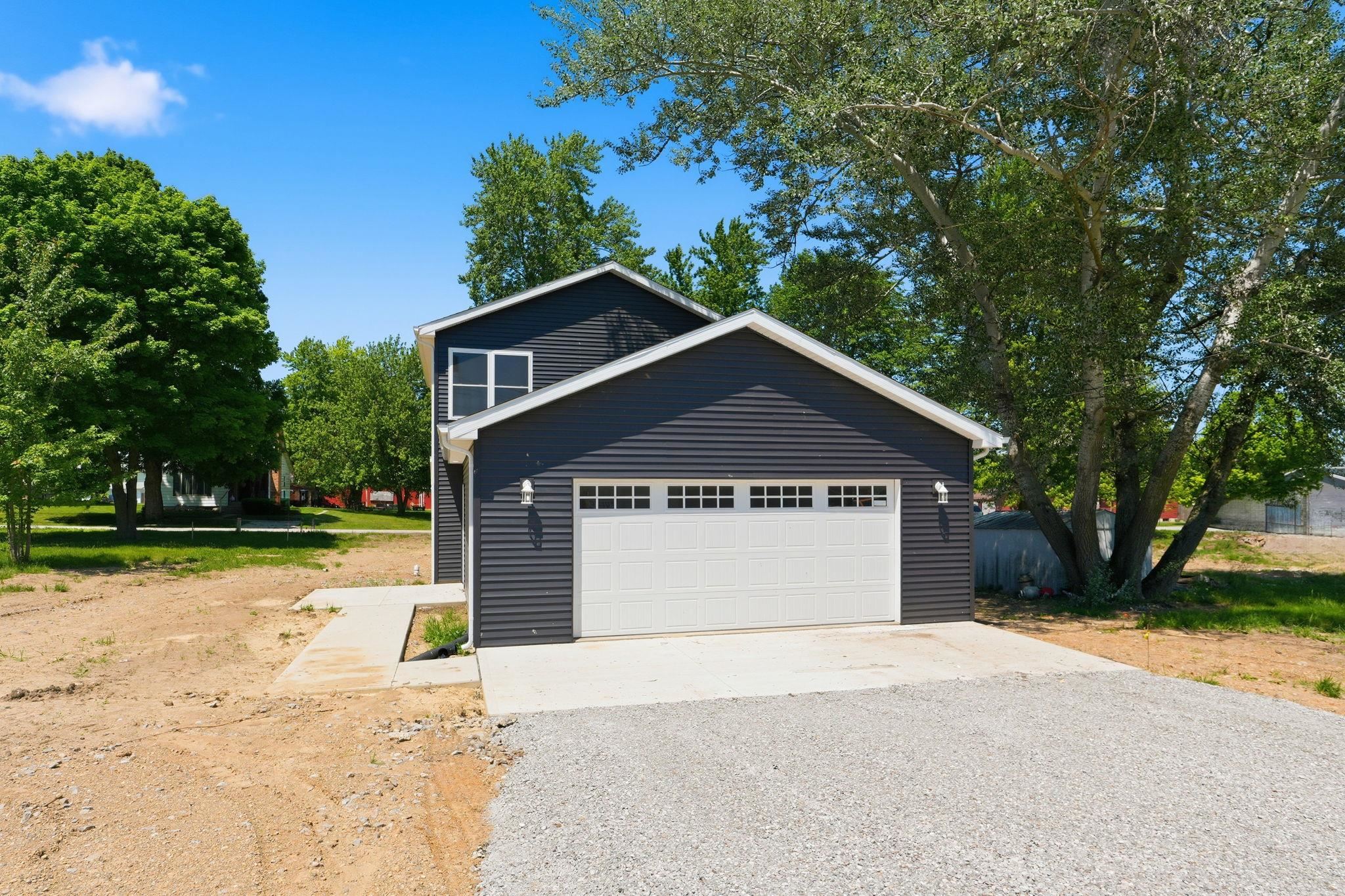 Dark-toned siding exterior with an attached two-car garage