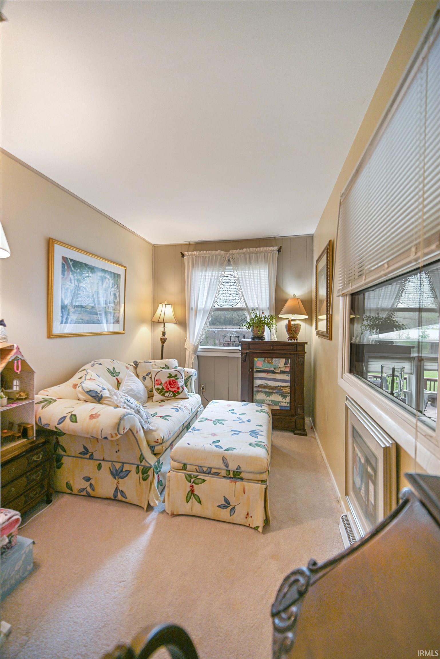 Wall-to-wall carpeting and neutral wall tones enhance this interior space