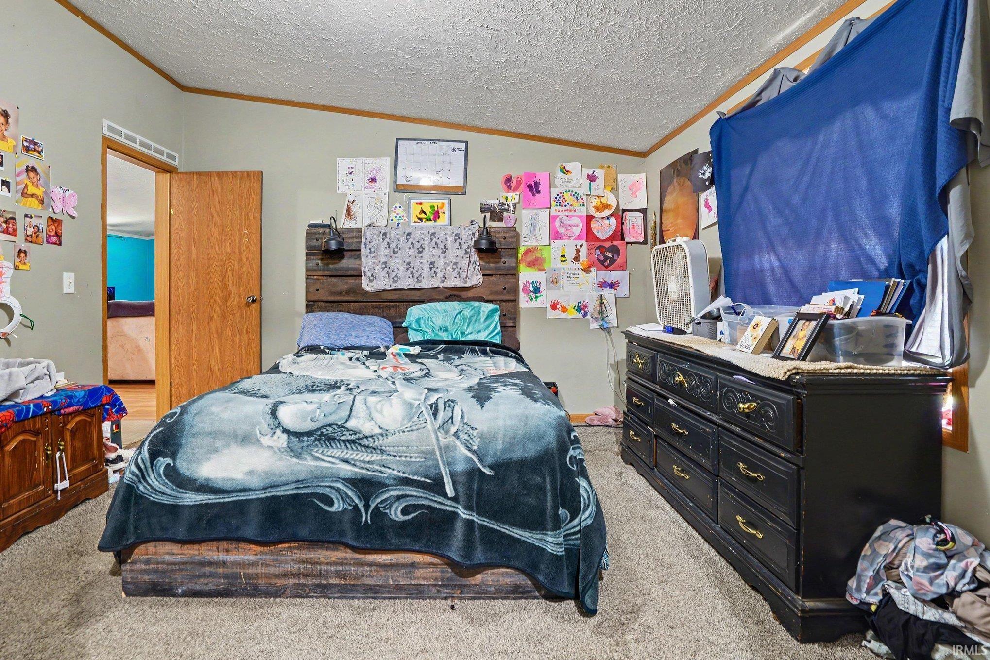 Wall-to-wall carpeting and neutral wall tones define this room