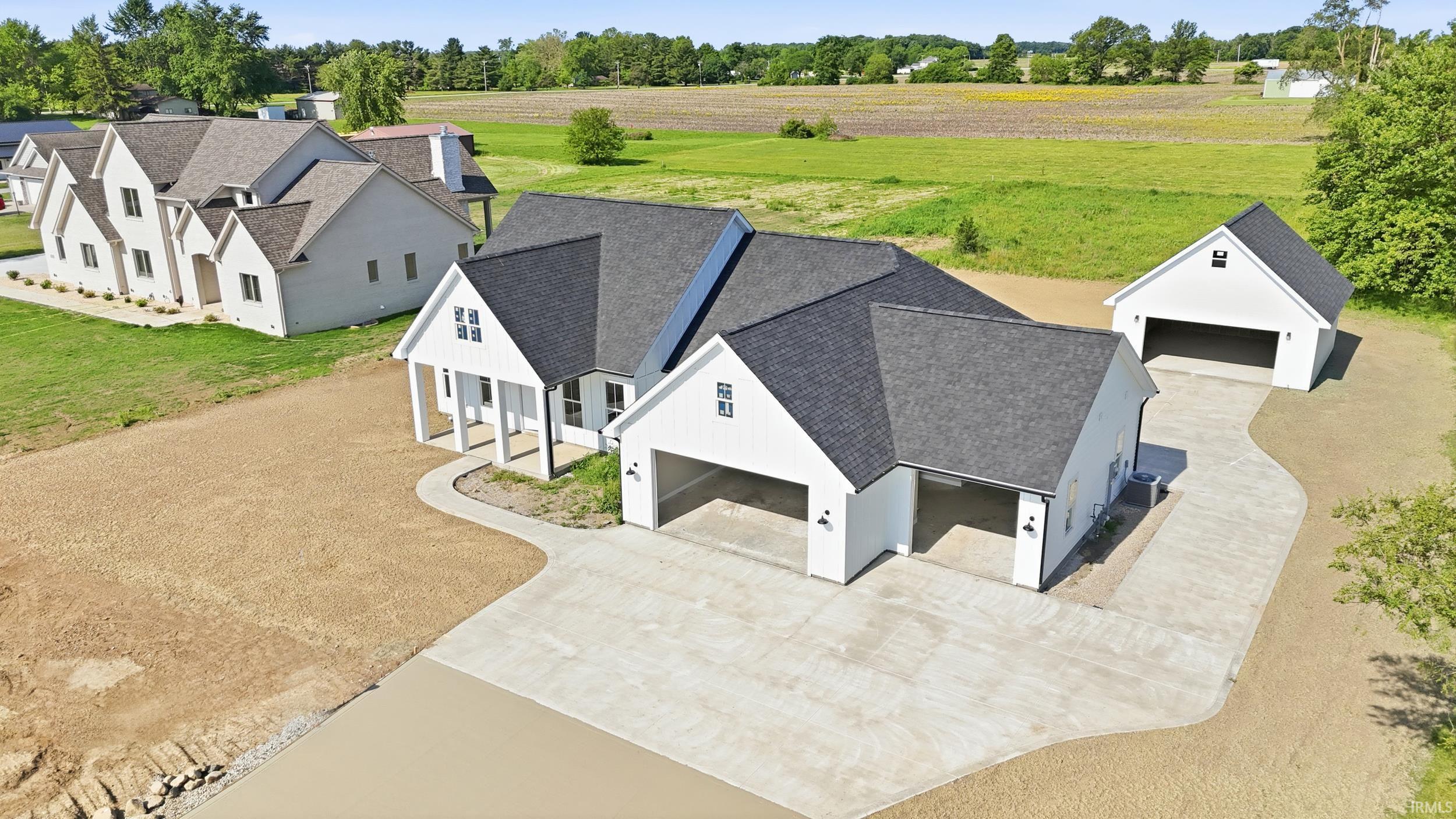 Contemporary white exterior with dark gabled roofing