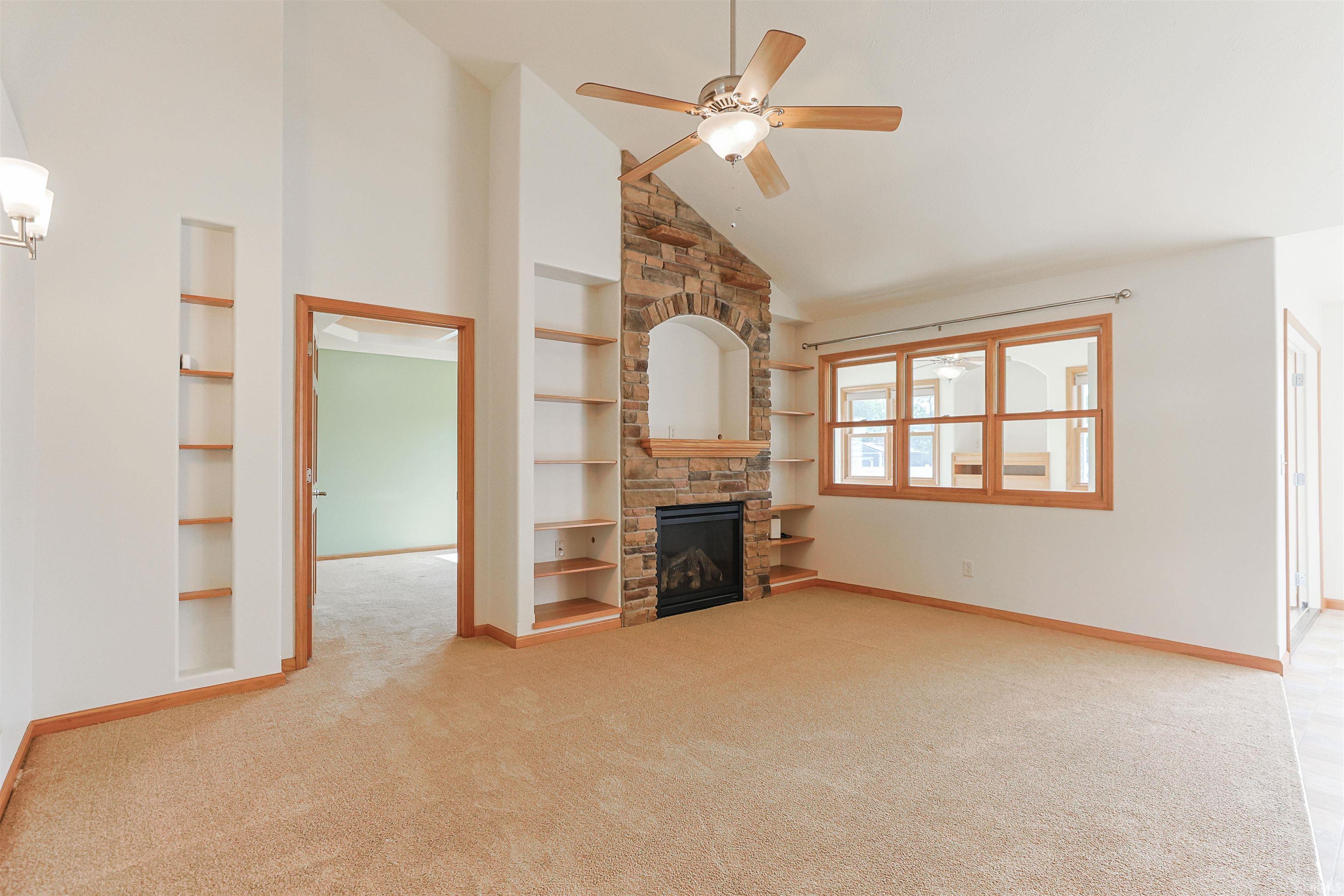 Vaulted ceilings with a ceiling fan overhead