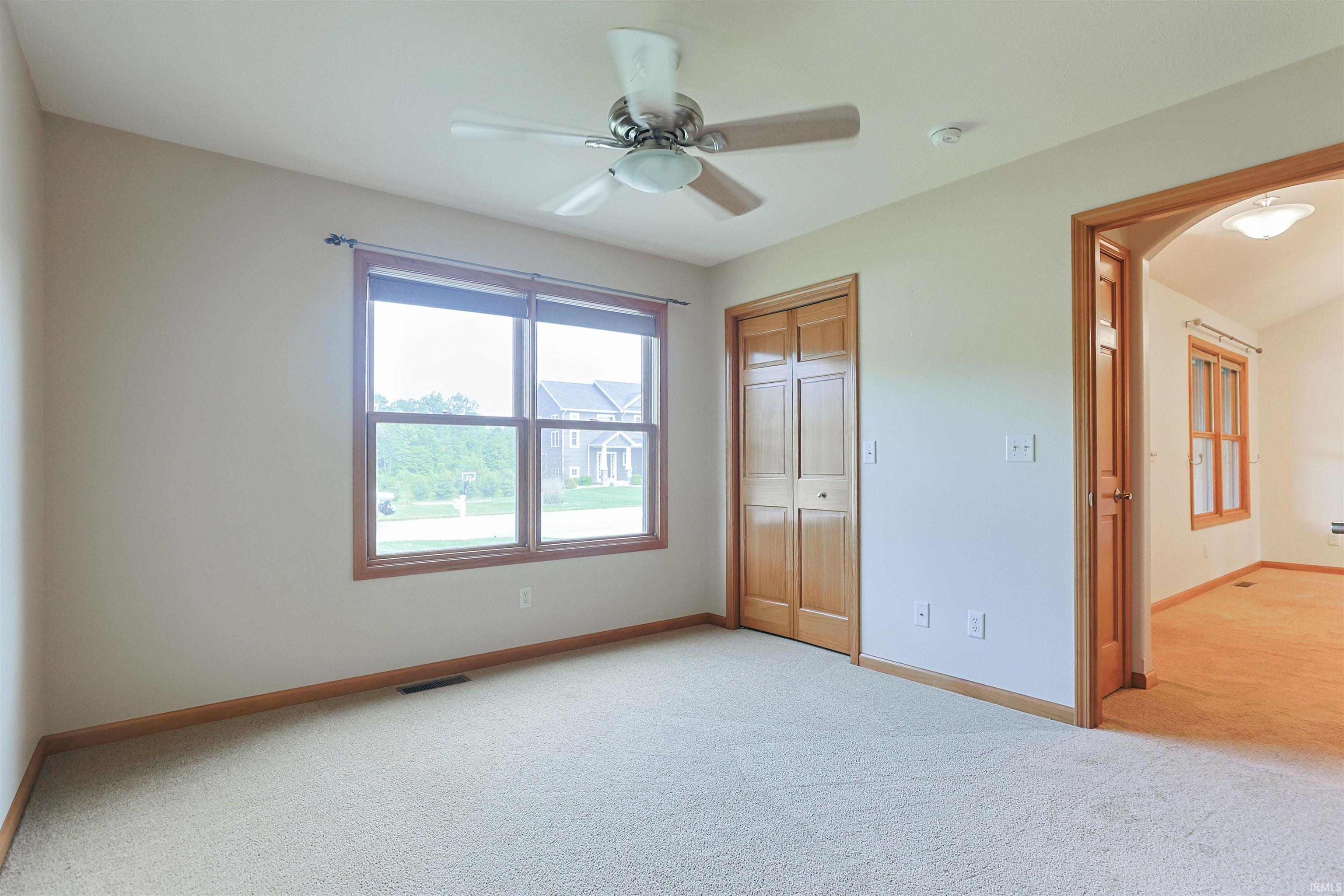 Neutral tone wall paint with a ceiling fan