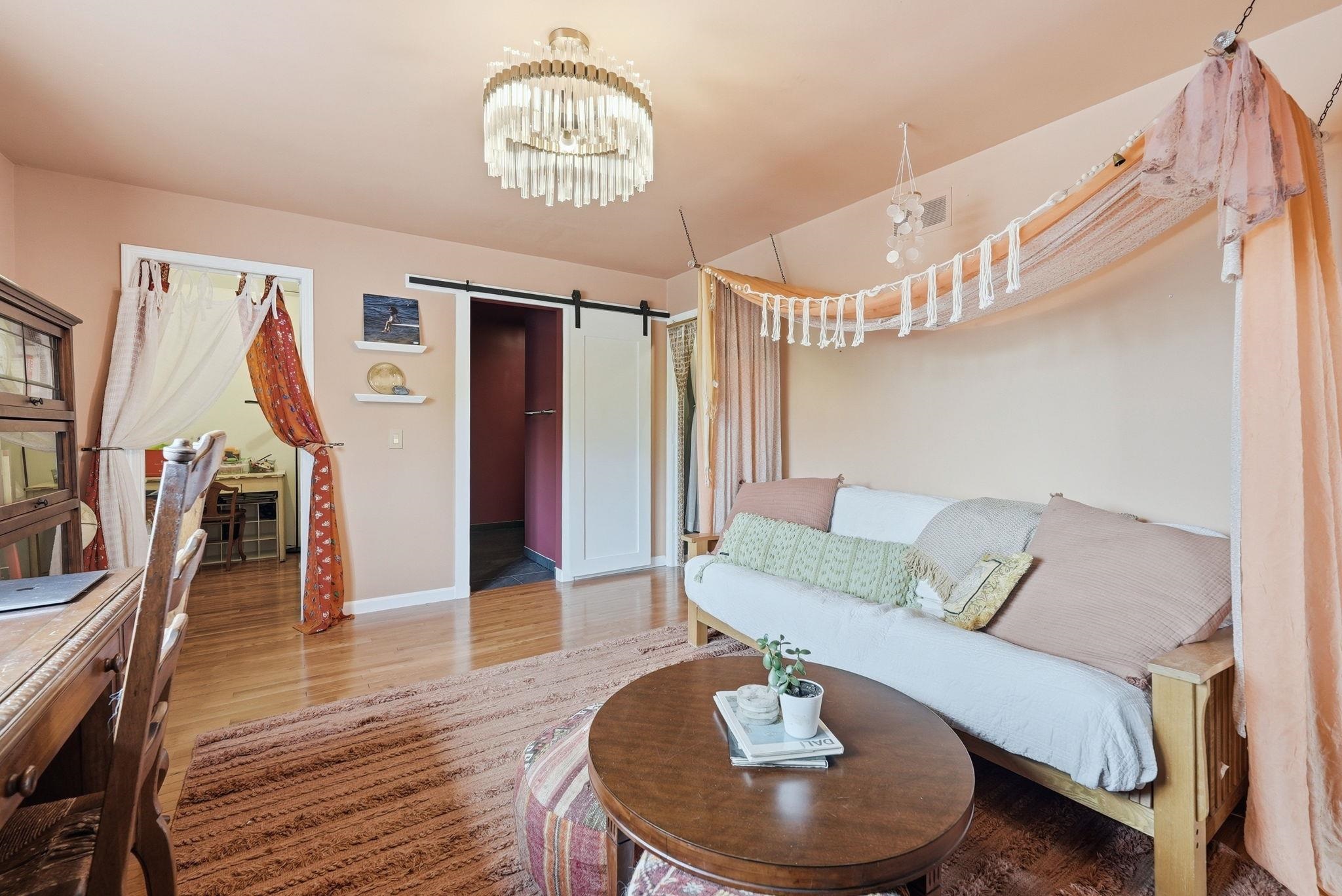 Polished wood-finish flooring complements light-toned walls