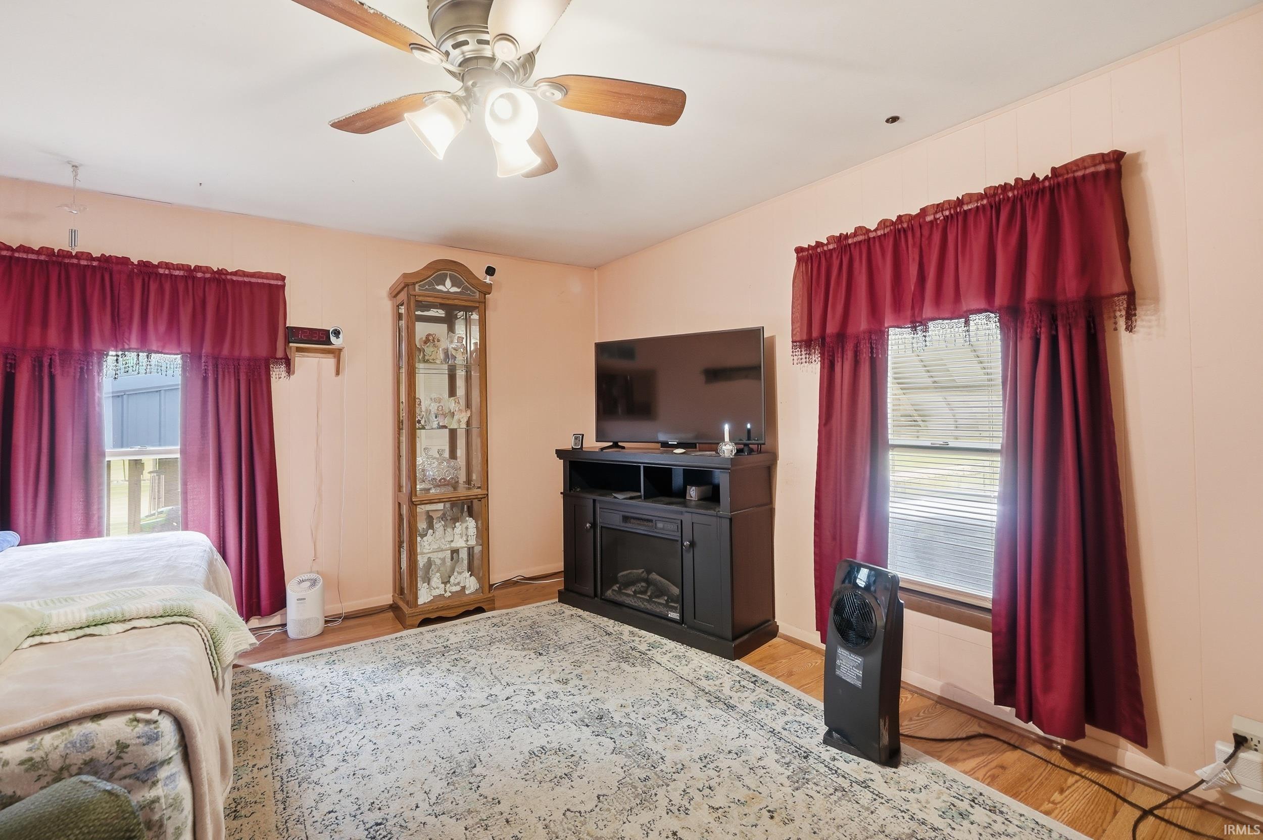 Ceiling fan light fixture and wood-finish flooring