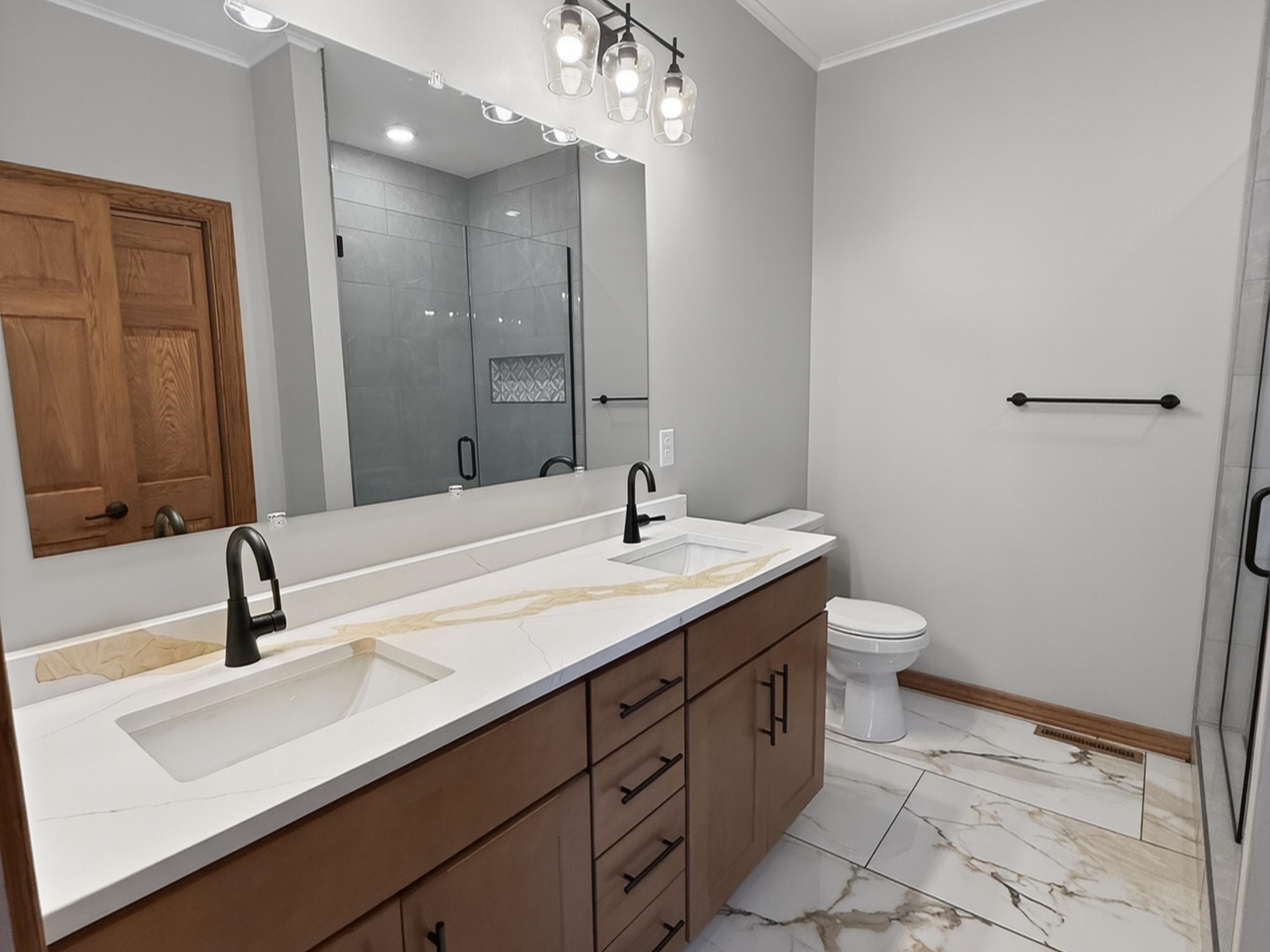 Dual vanity with integrated rectangular sinks and quartz-finish countertop