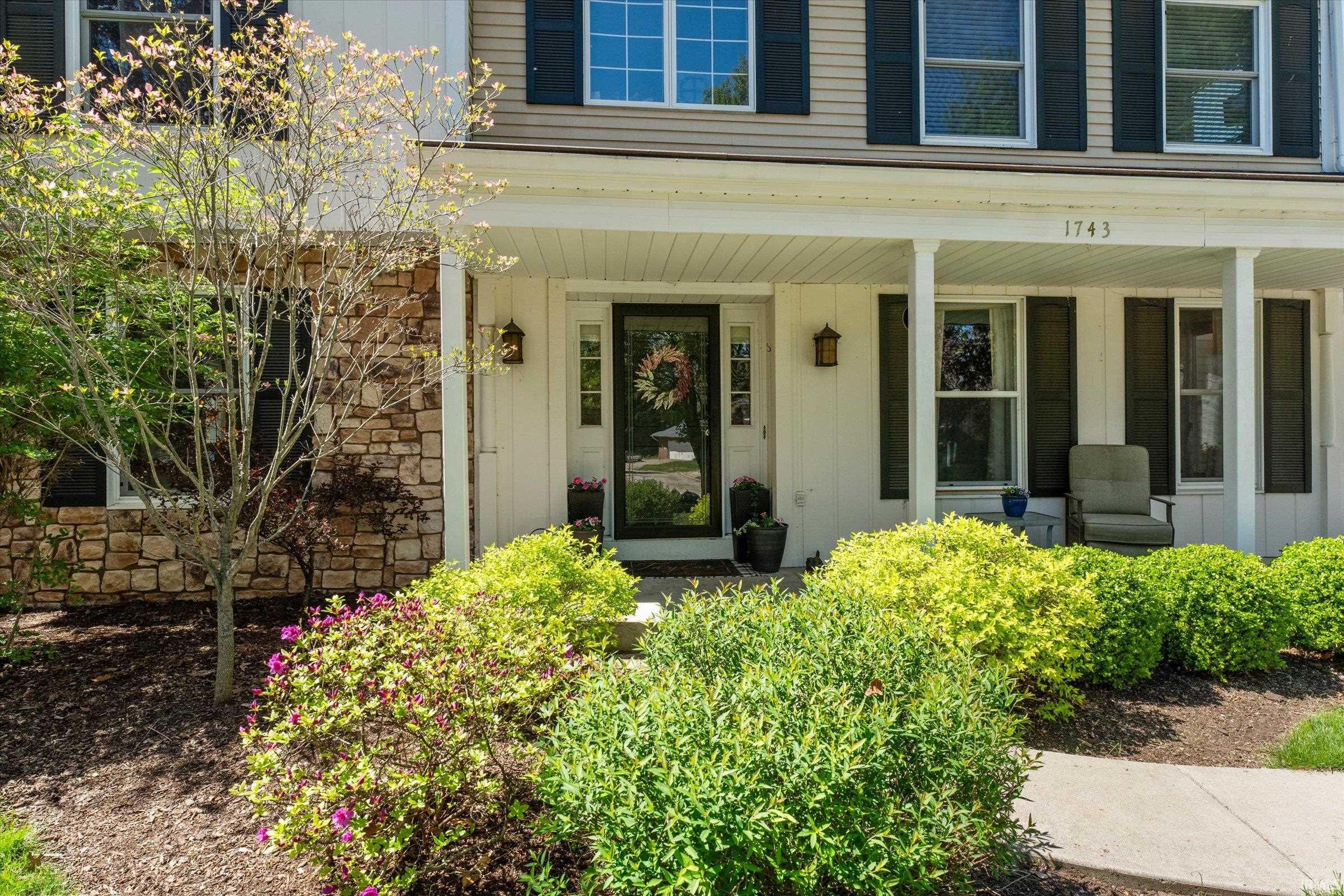Classic two-story facade with stone veneer accents