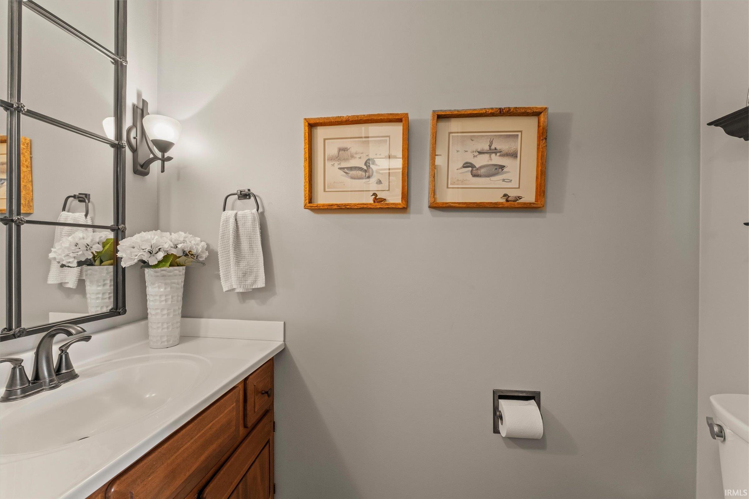 Bathroom vanity with a white countertop and an undermount sink