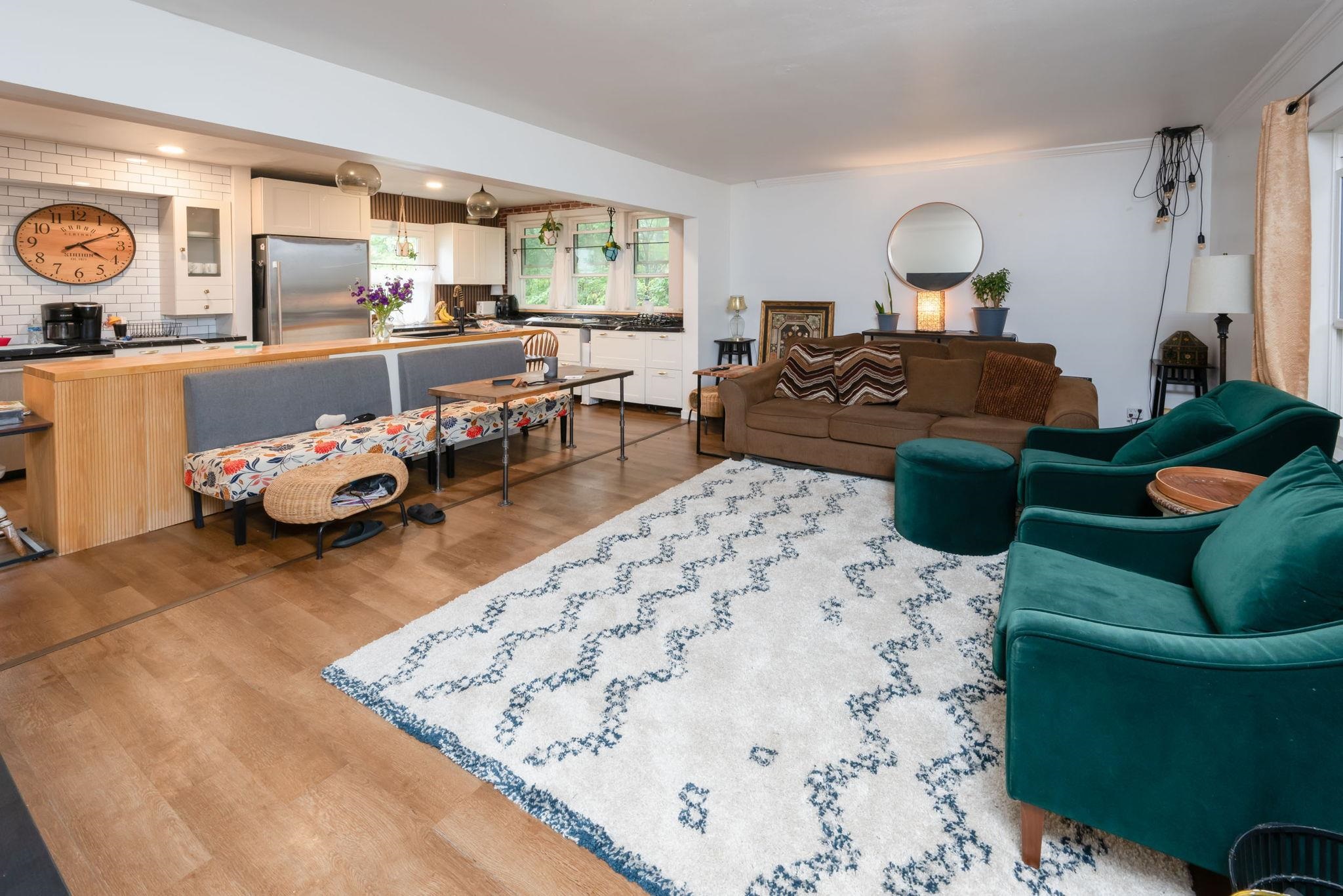 Open-concept living space featuring wood-finish flooring