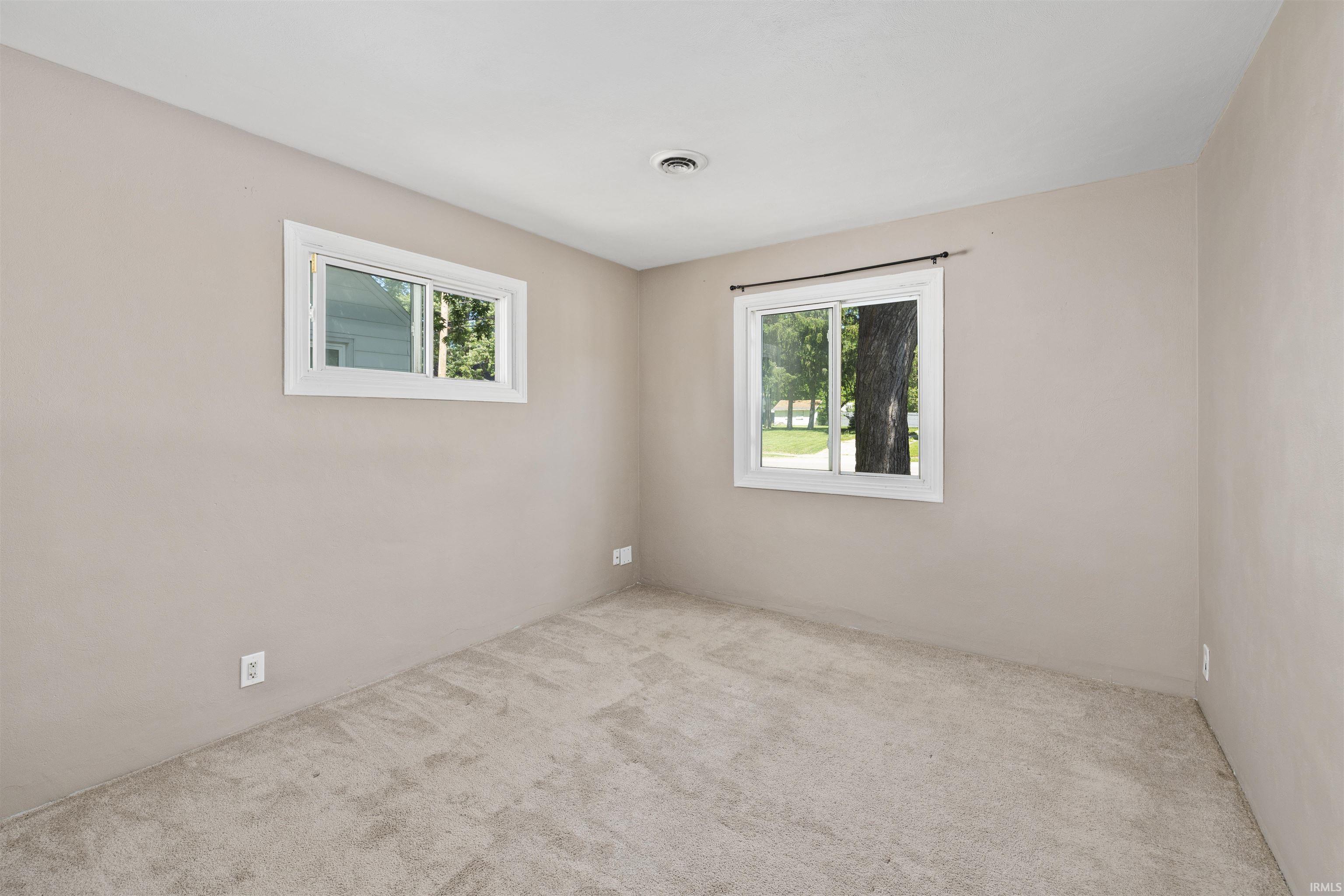Neutral-toned room with plush carpeting