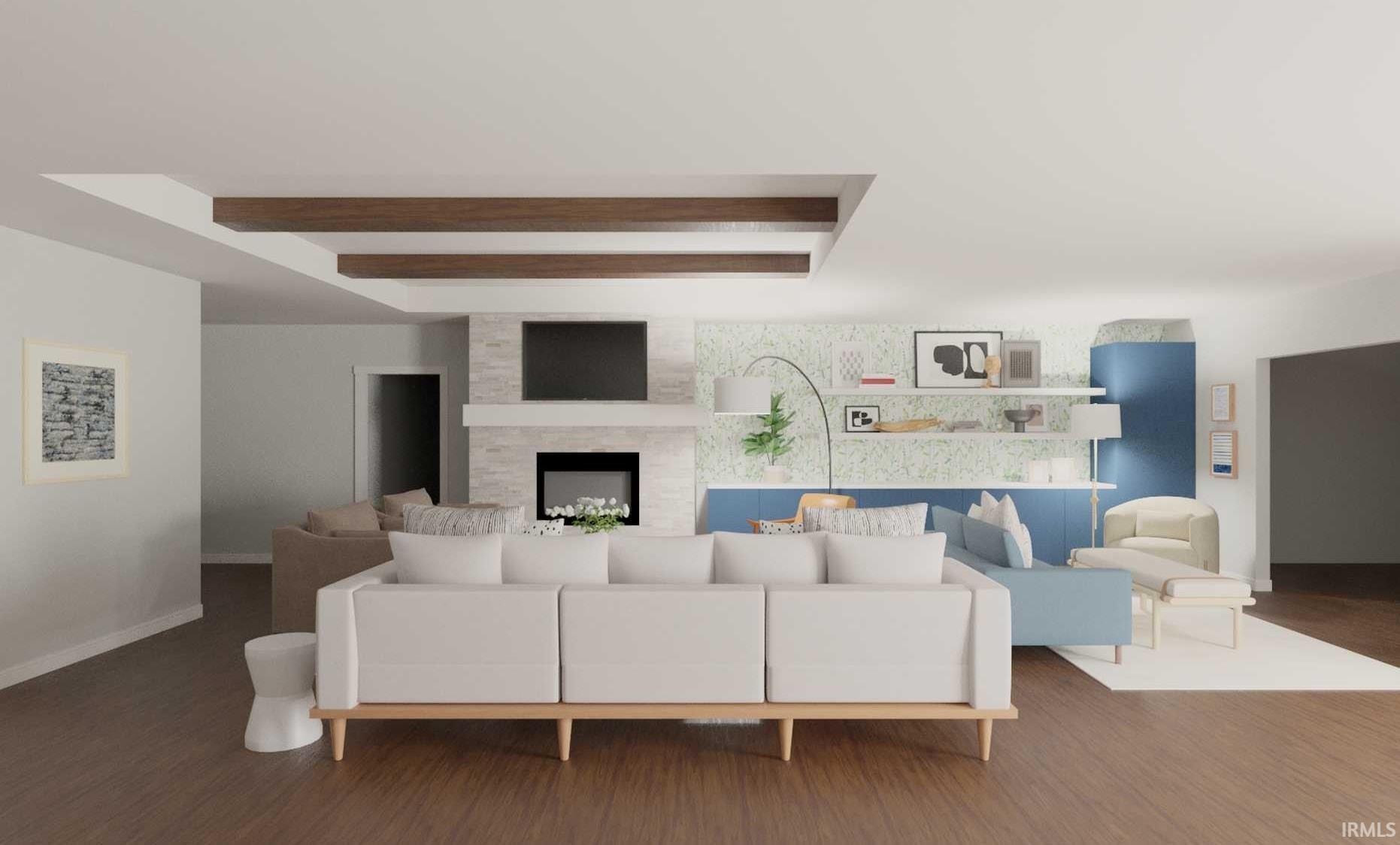 Spacious living area featuring wood-finish flooring, recessed ceiling with exposed wood beams, and a fireplace with a stone surround