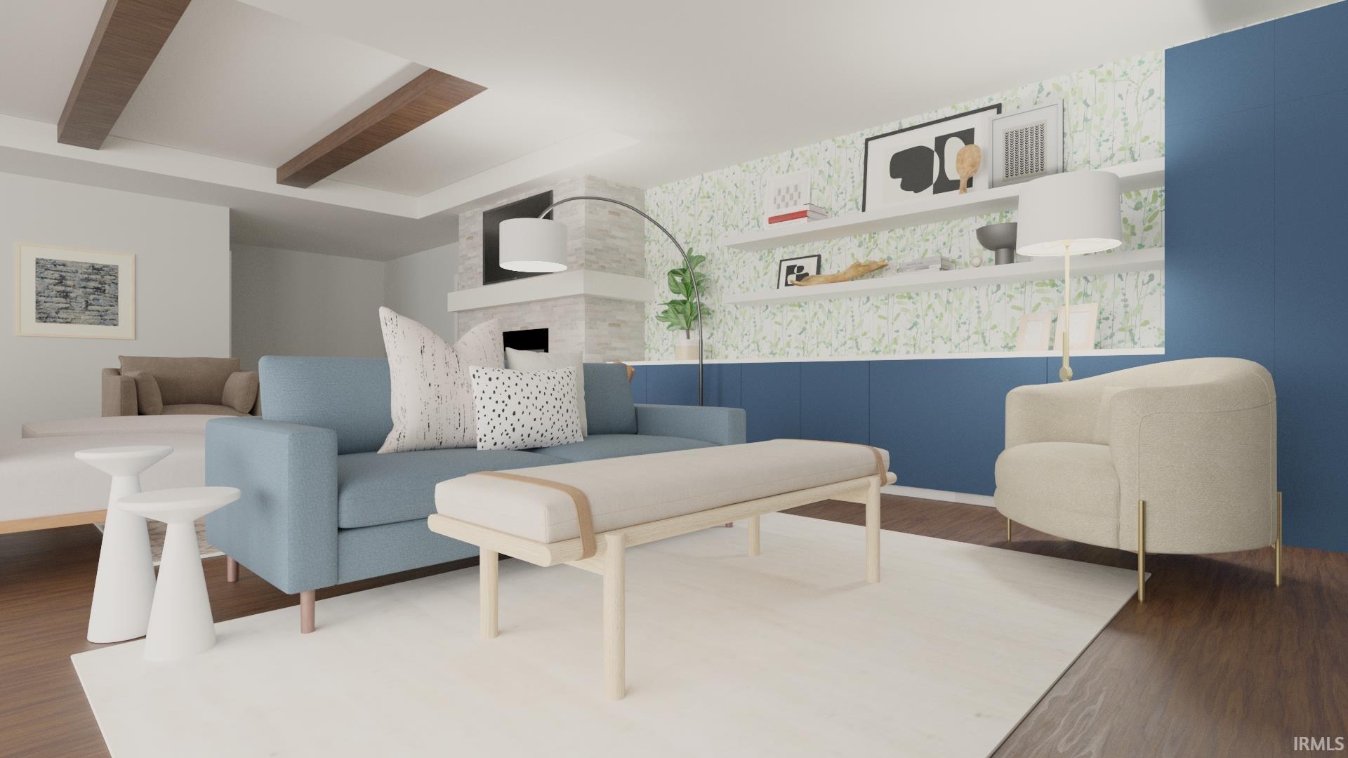 Living area featuring wood-finish flooring, exposed ceiling beams, a stone-clad fireplace, built-in blue cabinetry, and open shelving