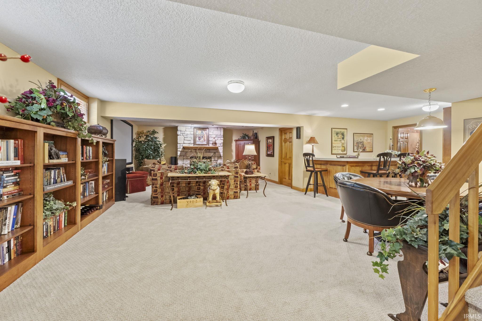 Spacious finished lower level with light-toned carpet flooring