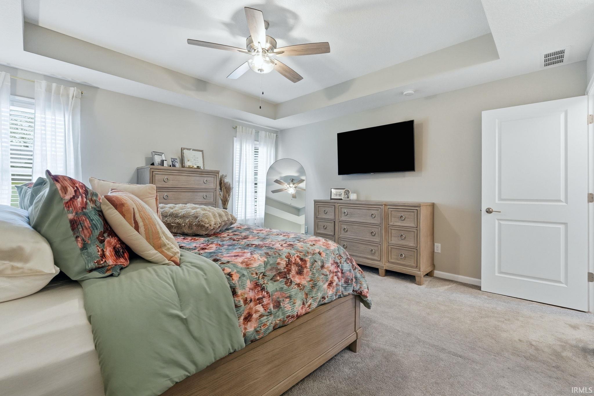 Recessed ceiling featuring a ceiling fan with integrated lighting