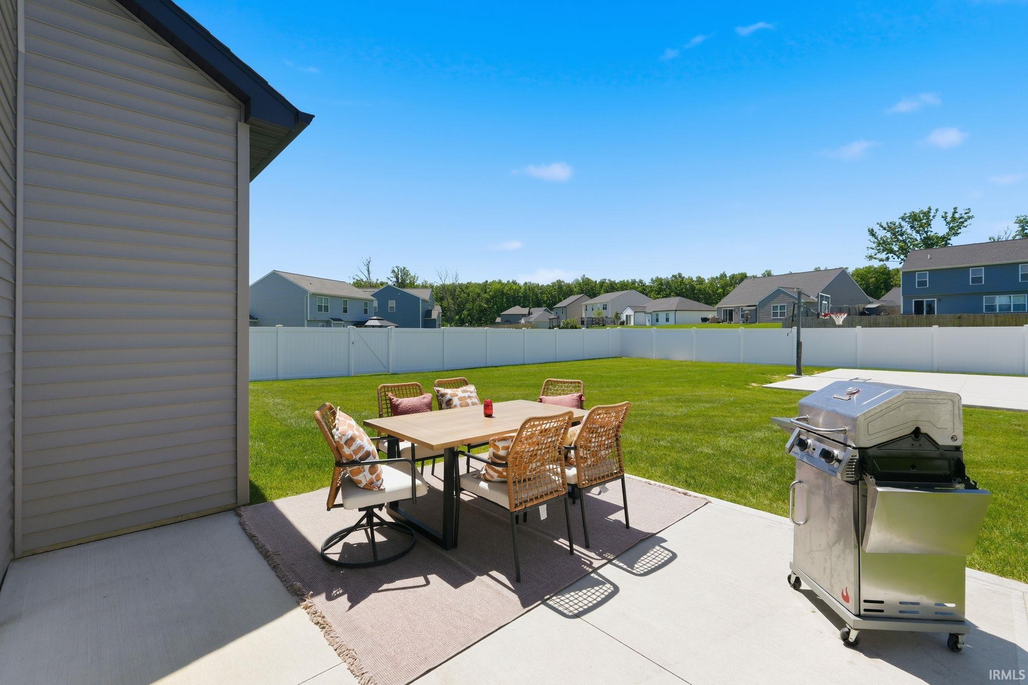 Expansive concrete patio offering a large outdoor living area