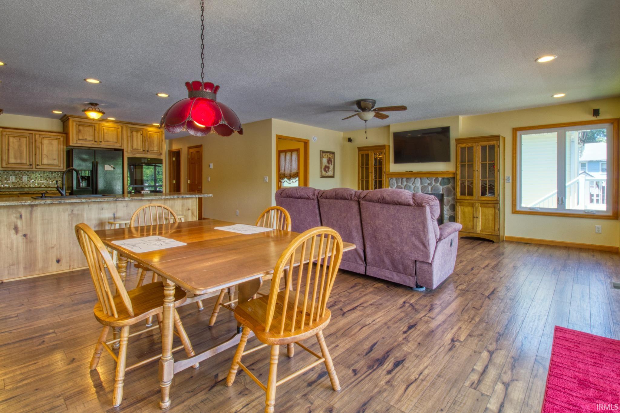Open concept living space featuring wood-finish flooring throughout