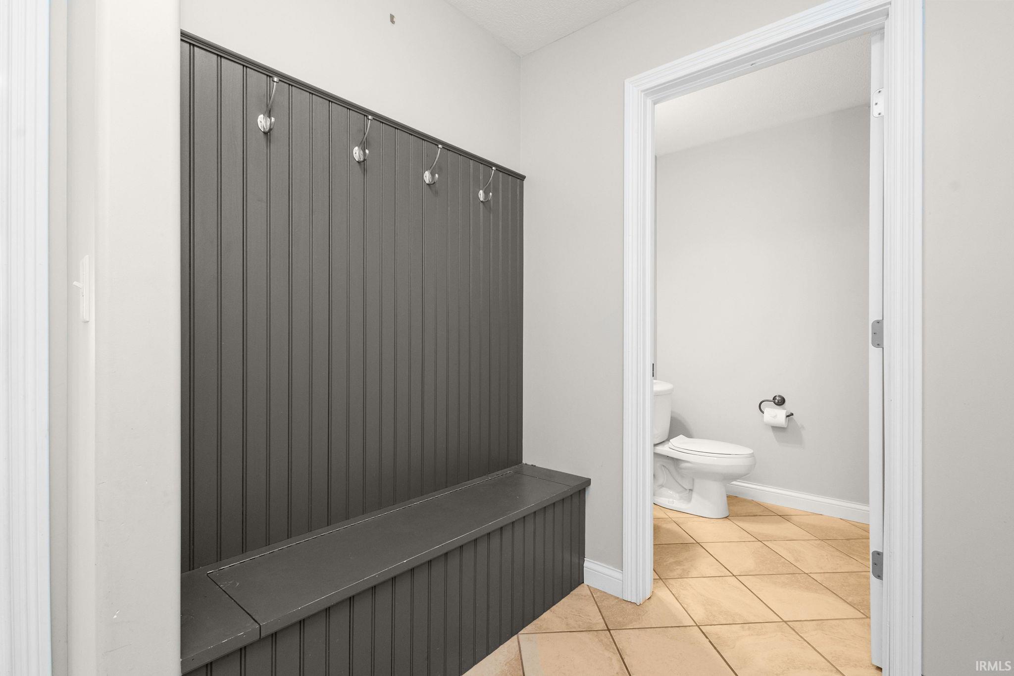 Drop zone steps from the garage and half bath