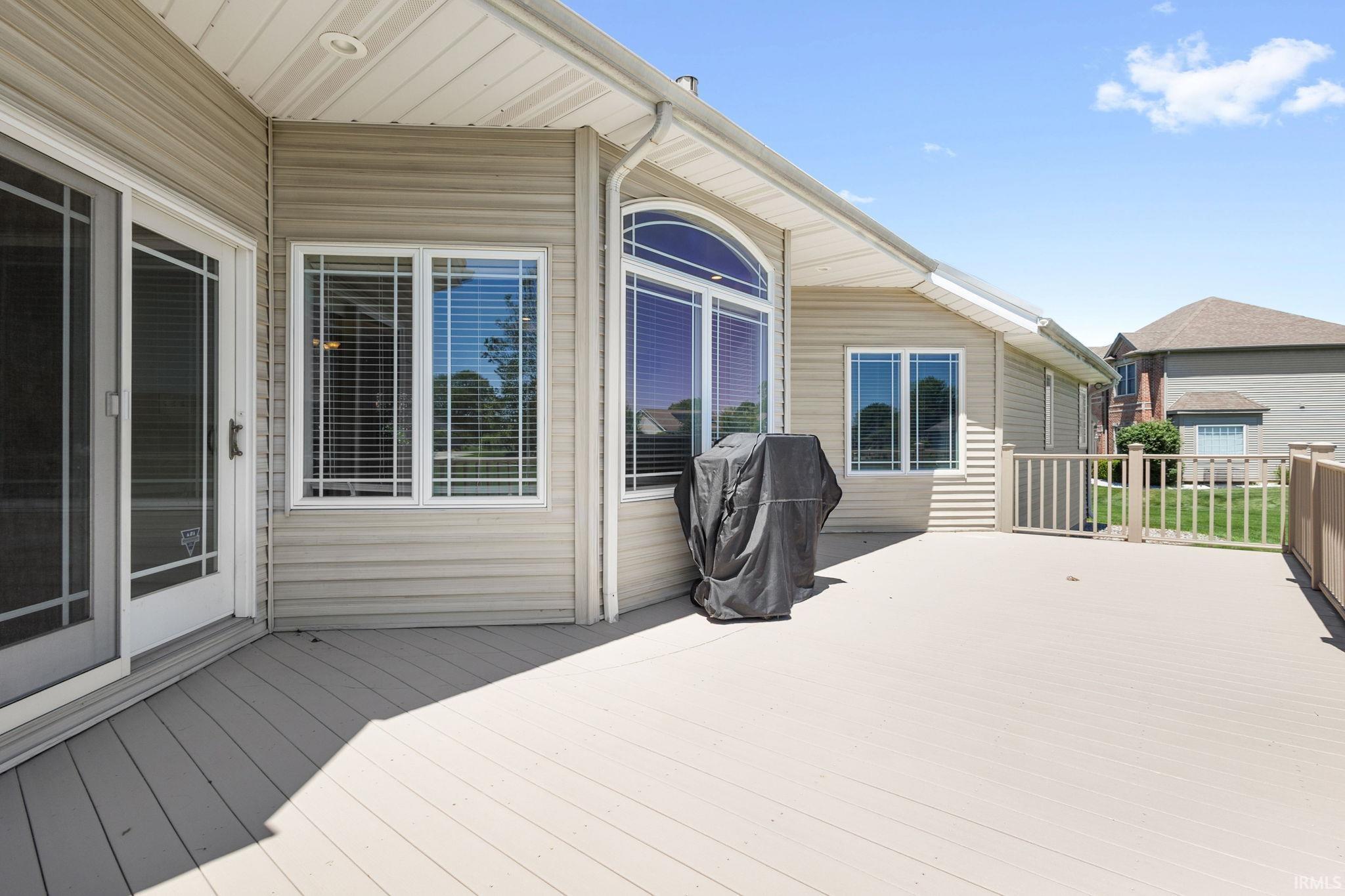 Spacious composite deck featuring a privacy rail and direct access to the interior via a sliding glass door