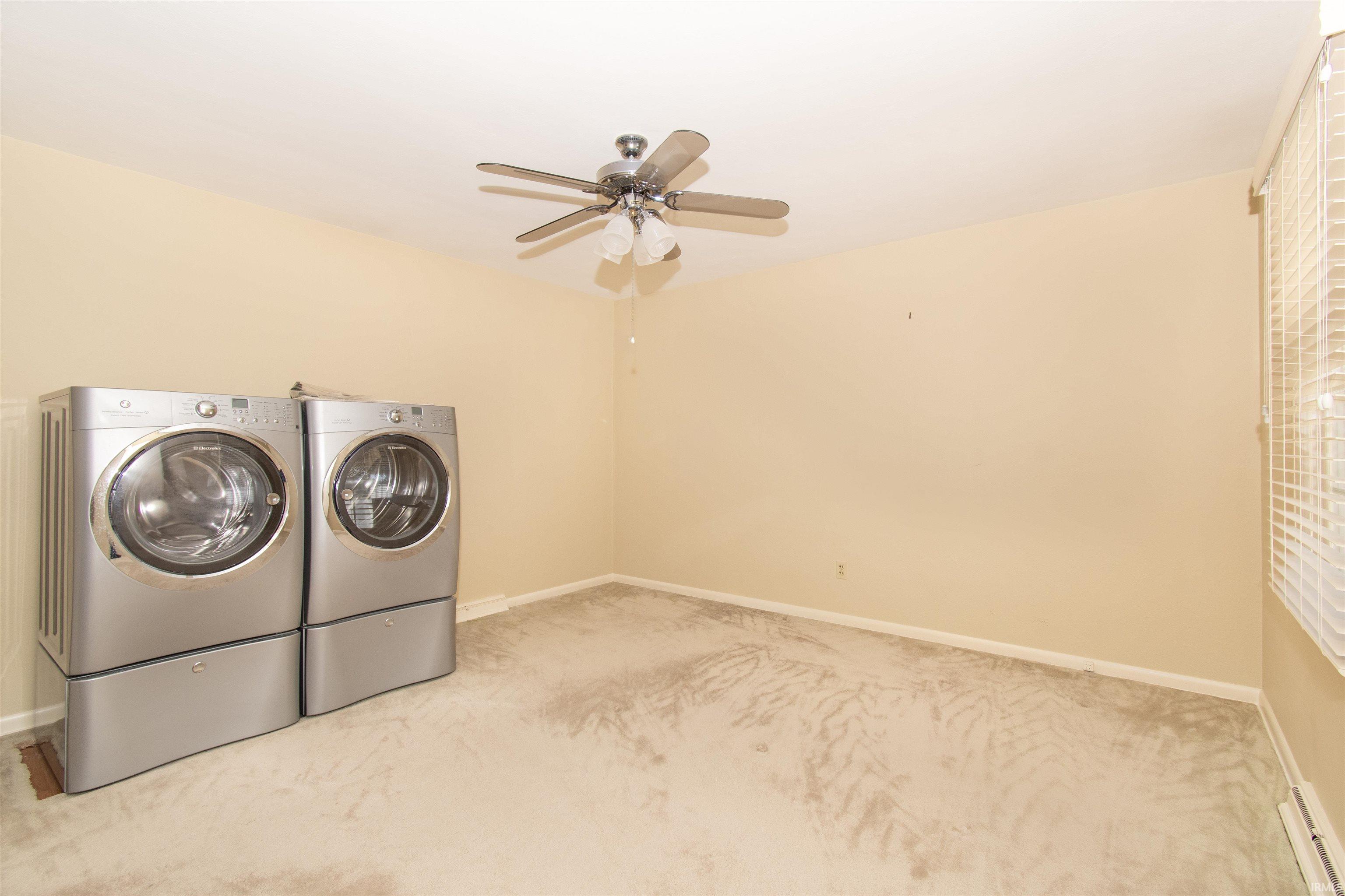 Laundry or 4th Bedroom. Room with carpet flooring, beige walls, and white ceiling
