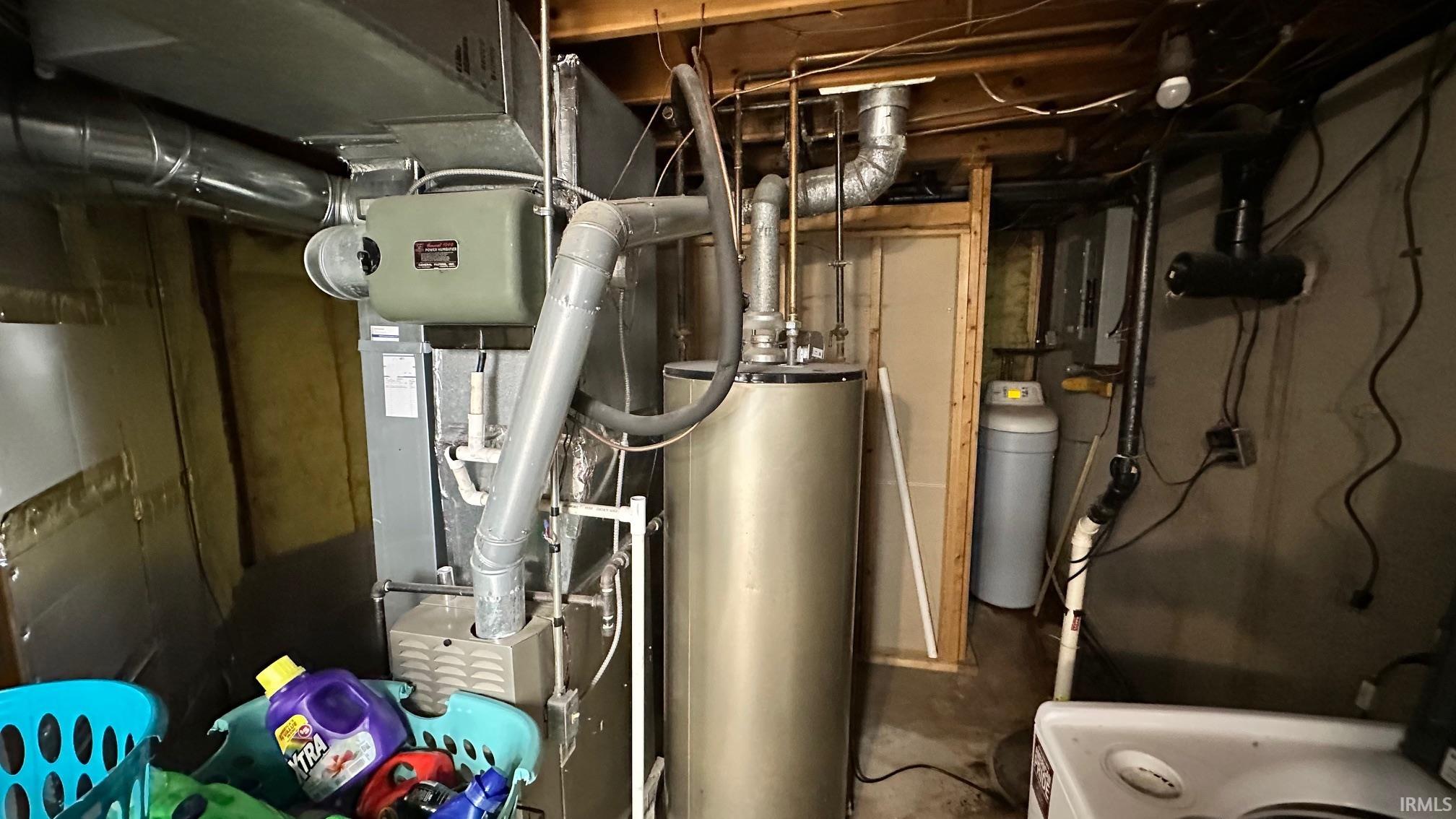 Utility area featuring a water heater, furnace, and water softener