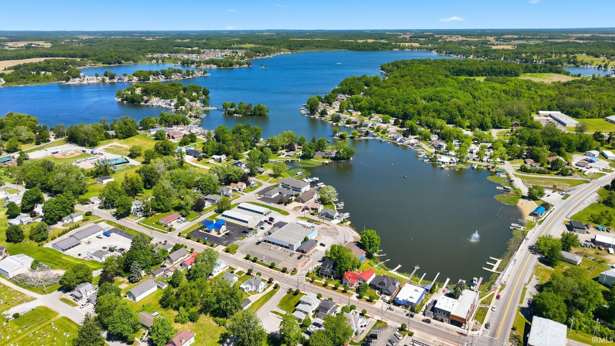 Aerial perspective showcasing a community situated around a large body of water