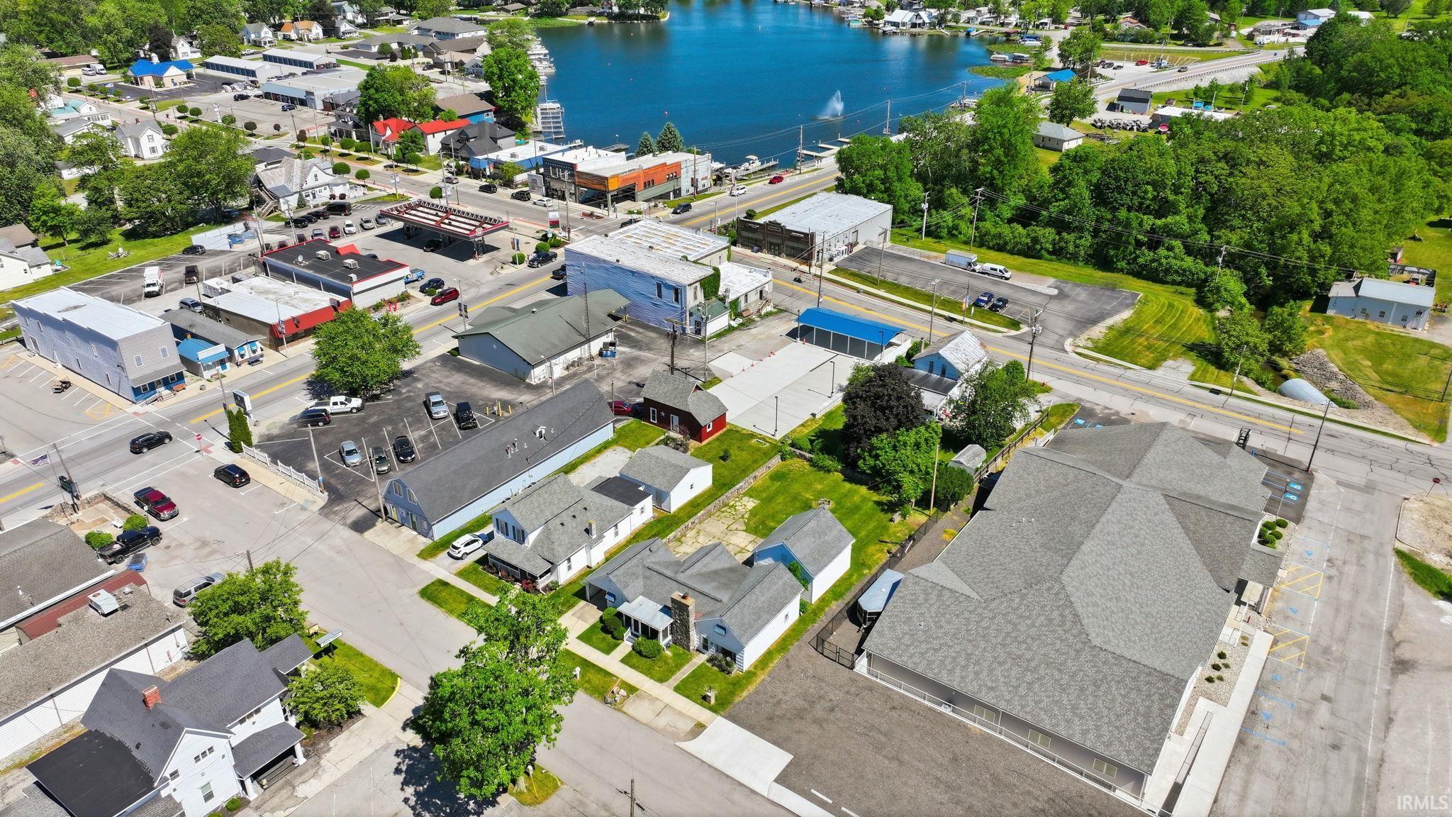 Aerial perspective showcasing a mixed-use neighborhood with commercial and residential properties