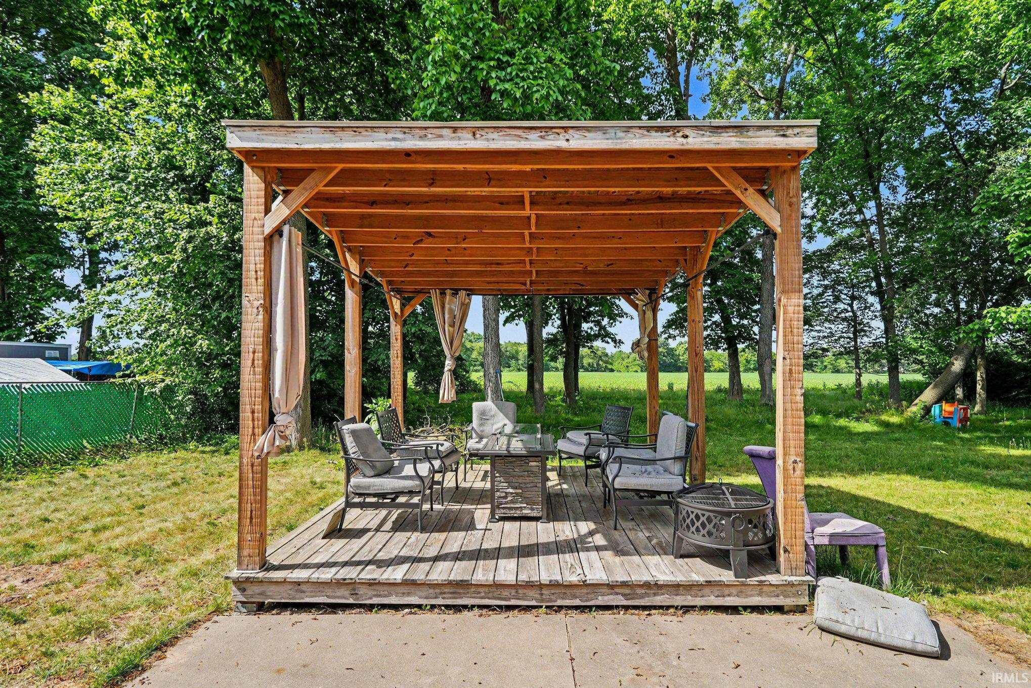 Wood-framed covered deck with a wood-plank floor