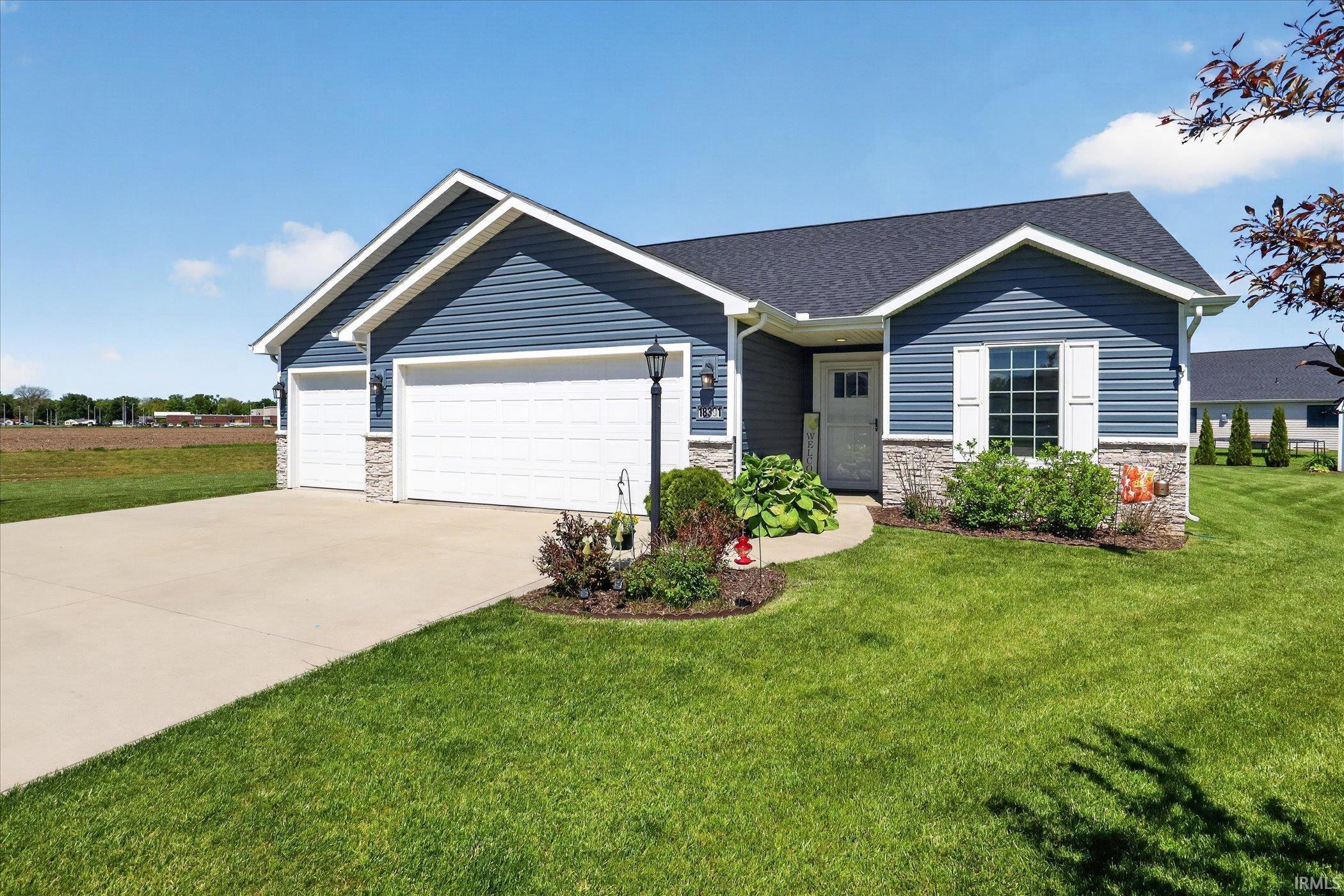 Blue siding exterior with stone veneer accents