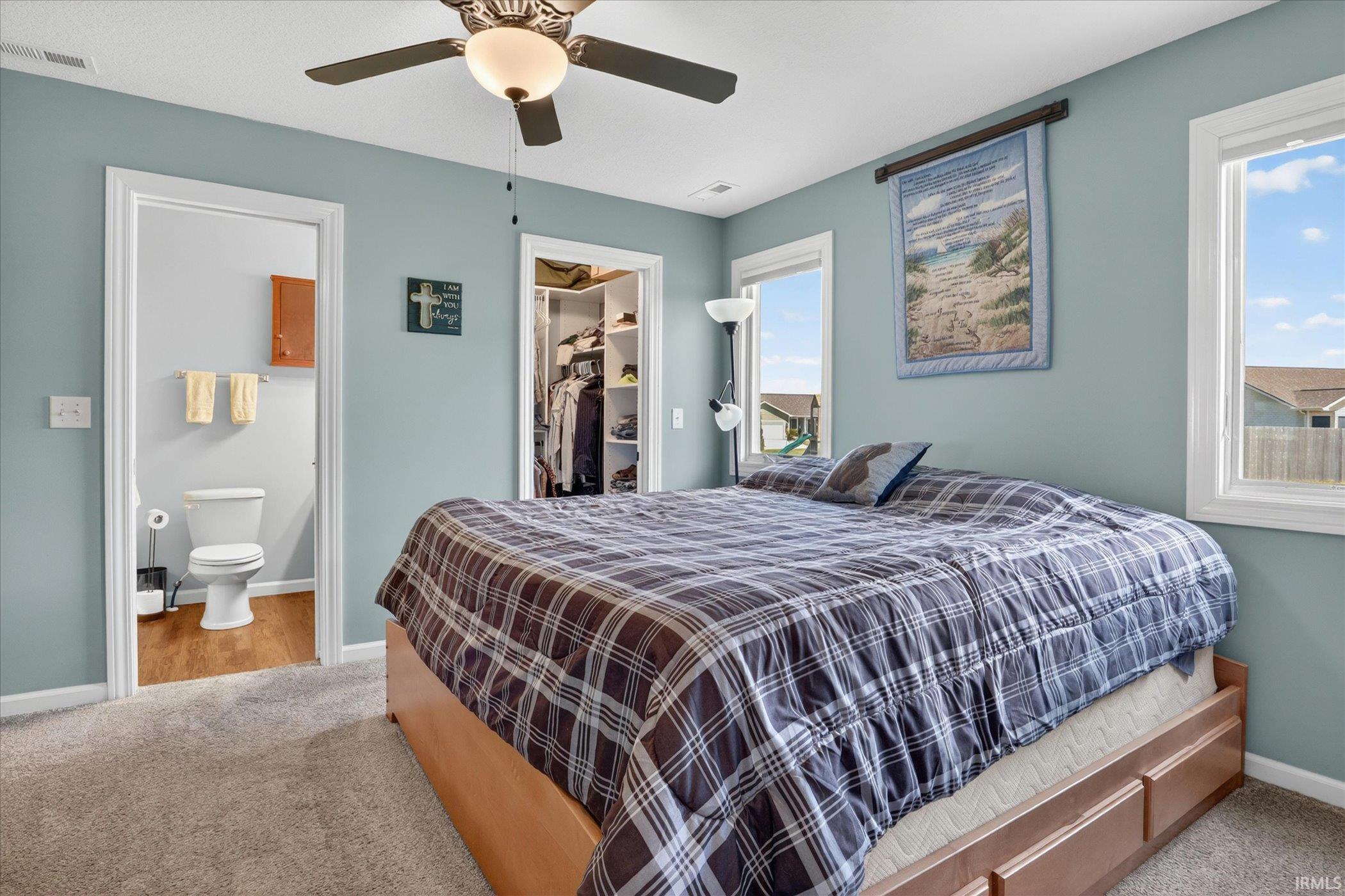 Bedroom featuring carpet flooring and light blue wall paint