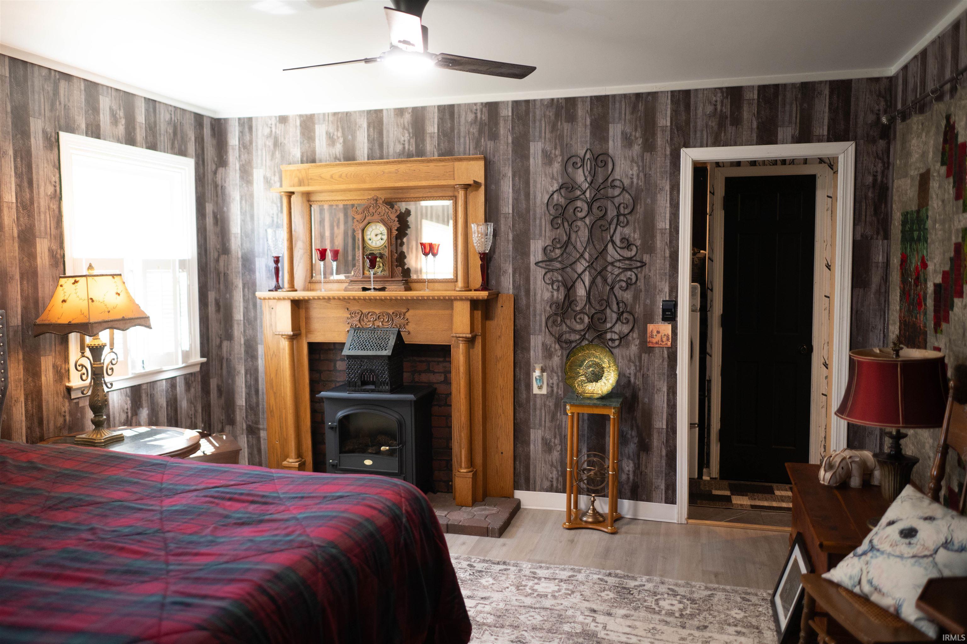 Room featuring wood-finish accent walls and light wood-finish flooring