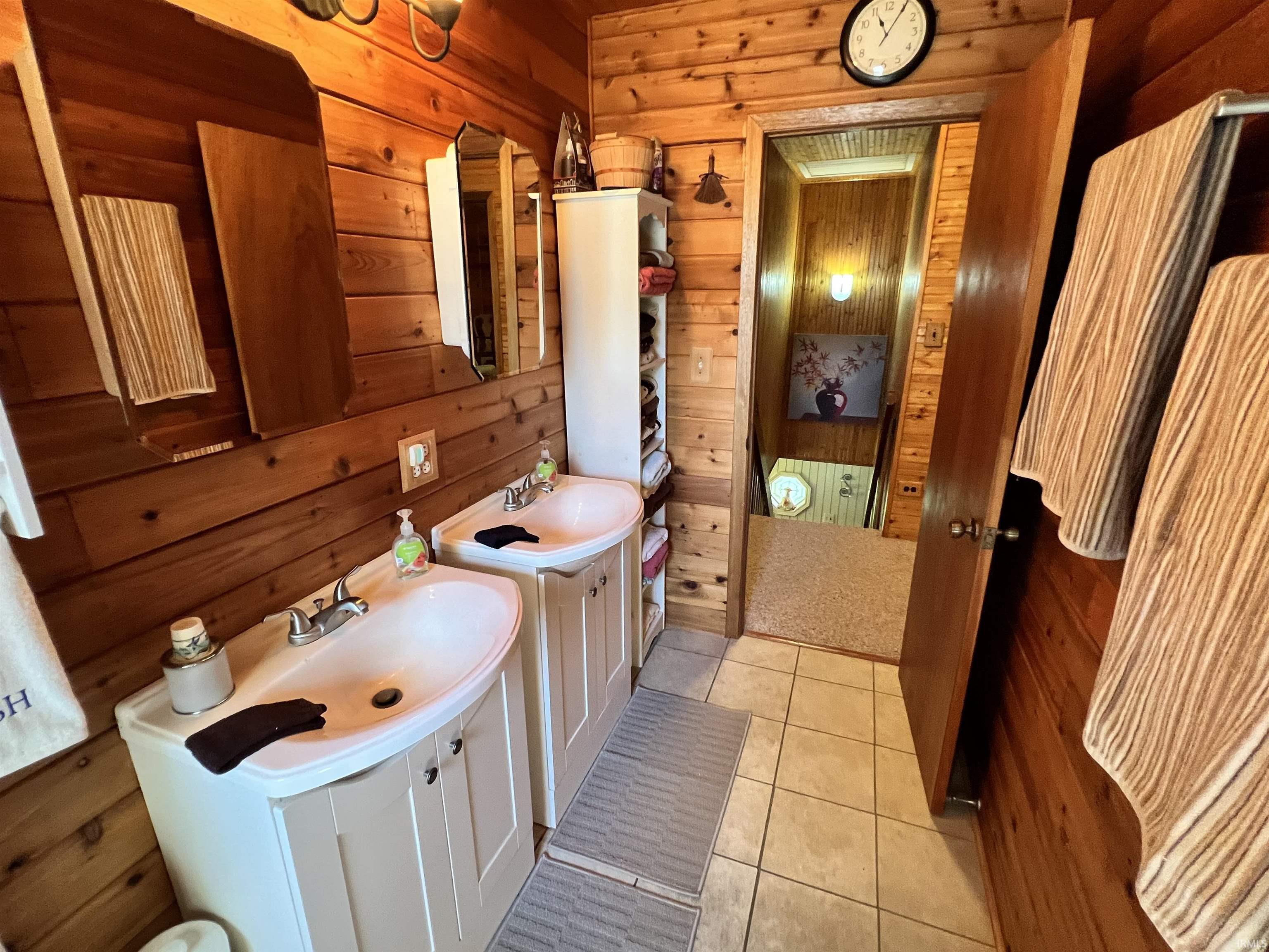 Dual vanity with white ceramic sinks and chrome fixtures